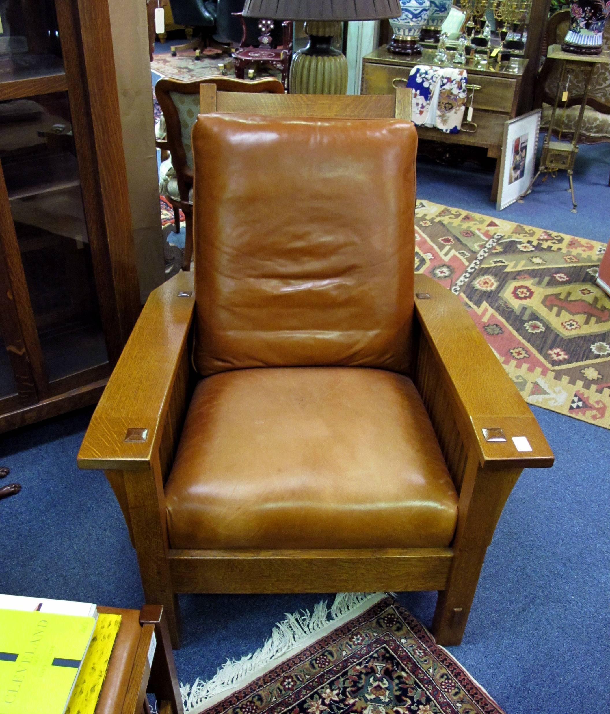 This stickley light brown leather side chair is very soft, with Mission style oakwood working.
It stands 39