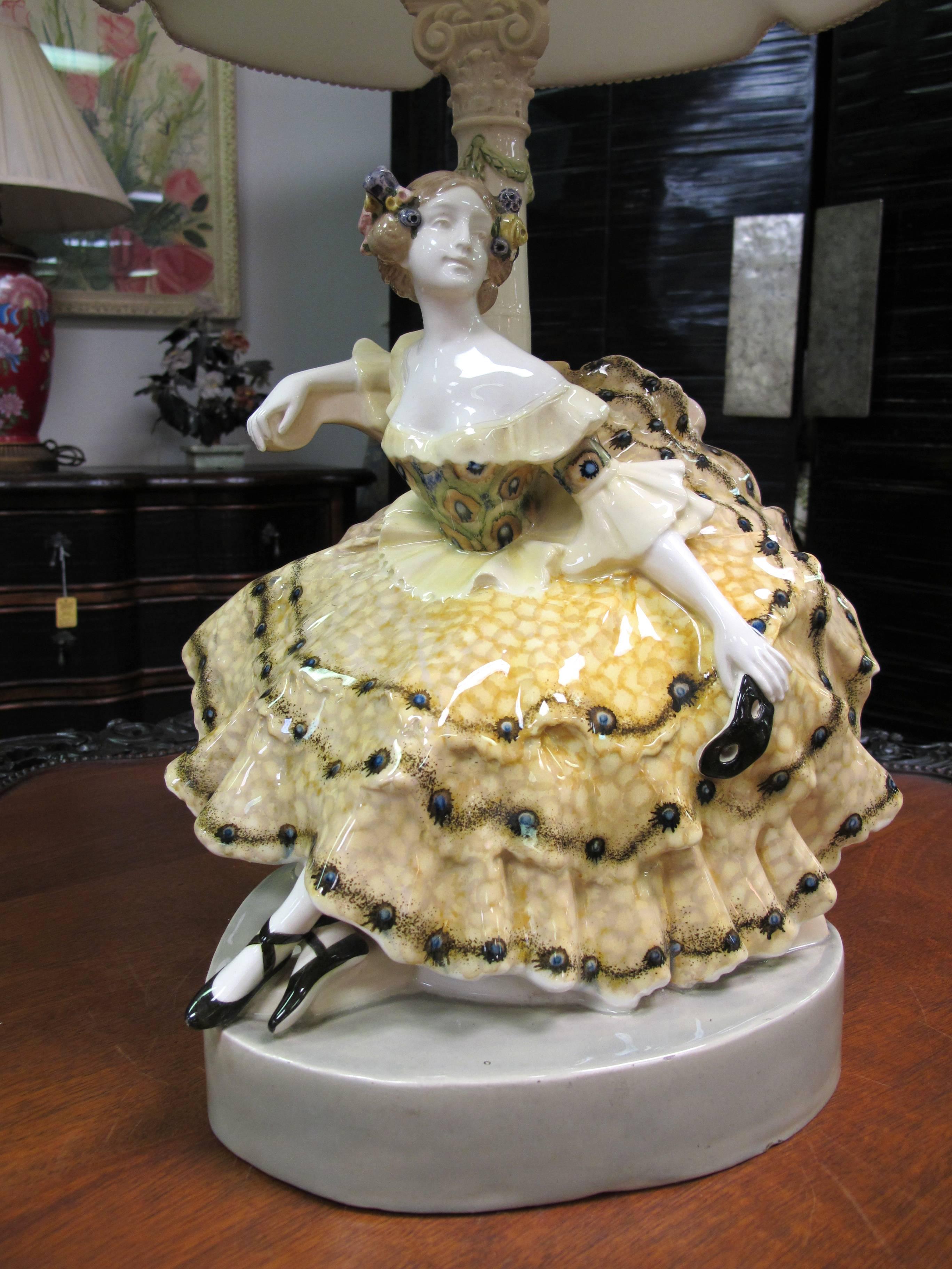 Southern belle lady lamp by Podolo for Goldscheider, circa 1922. The glazed porcelain lamp stands 33