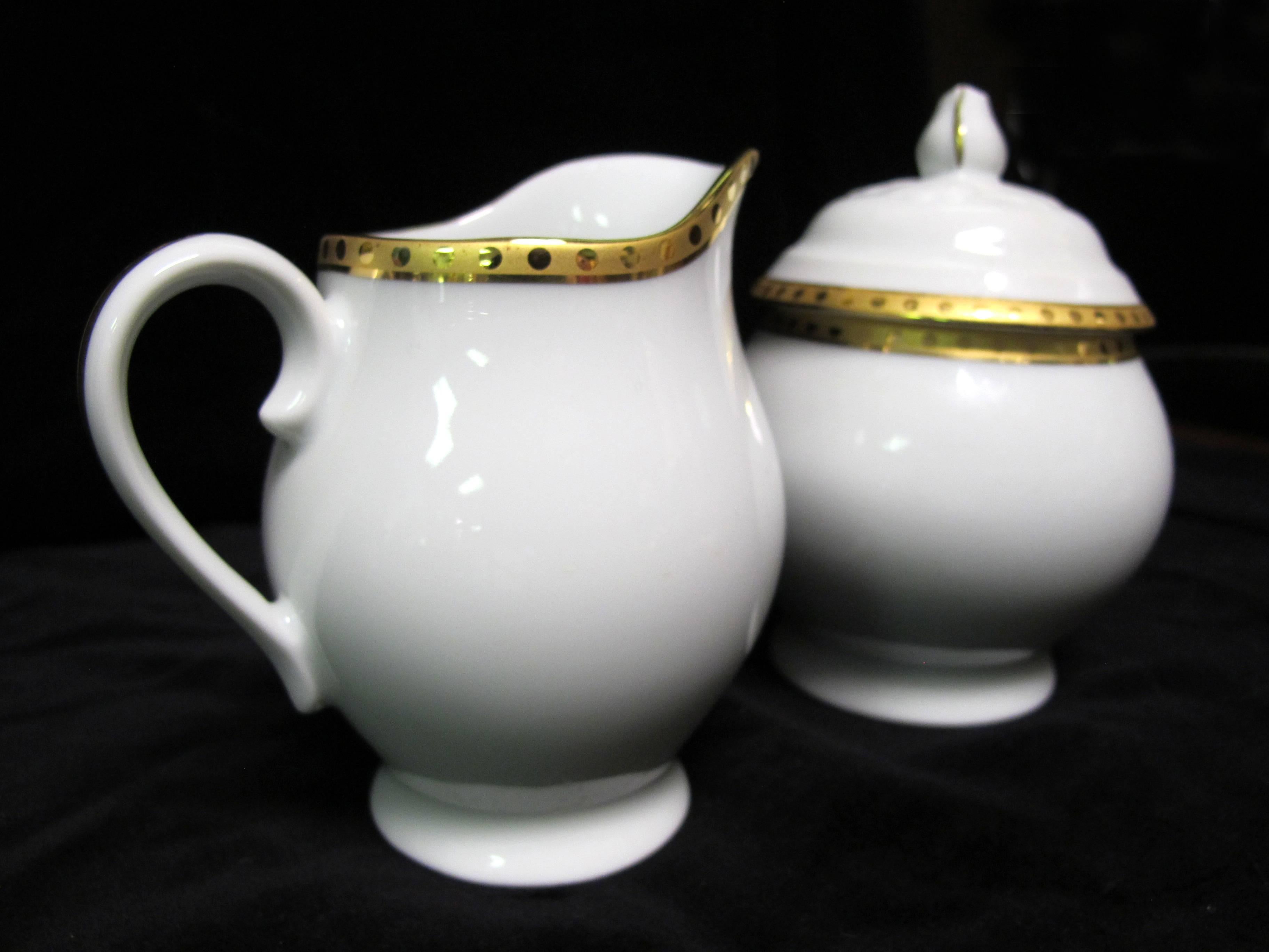 Tiffany & Co. Sugar and Creamer with Lid. 
In perfect condition.
Measures: Sugar: 4 x 4 x 5.5