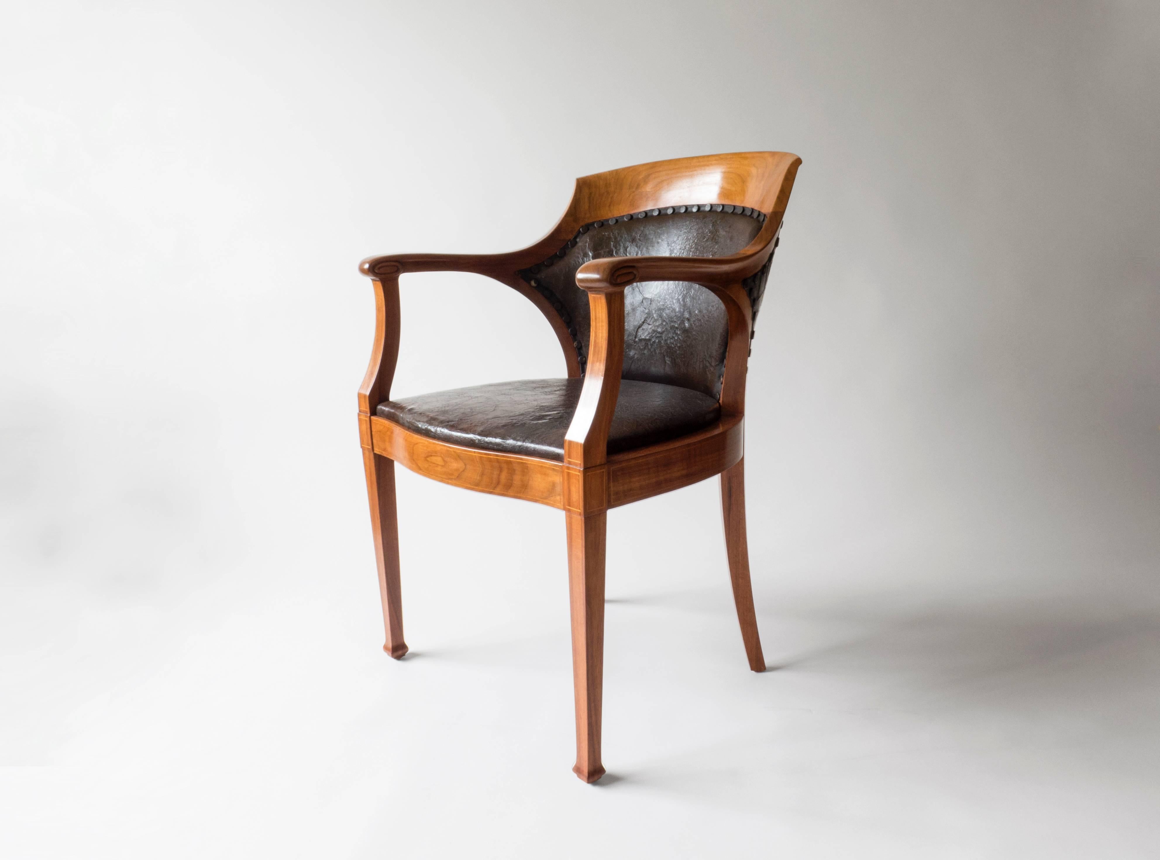 A beautiful synthesis of Classicism and Art Nouveau that exemplifies the sophisticated Nordic Jugend style. An exceptional example, the piece is high-quality, large and comfortable. The beautiful soft polish radiates a warm amber glow. The seat and