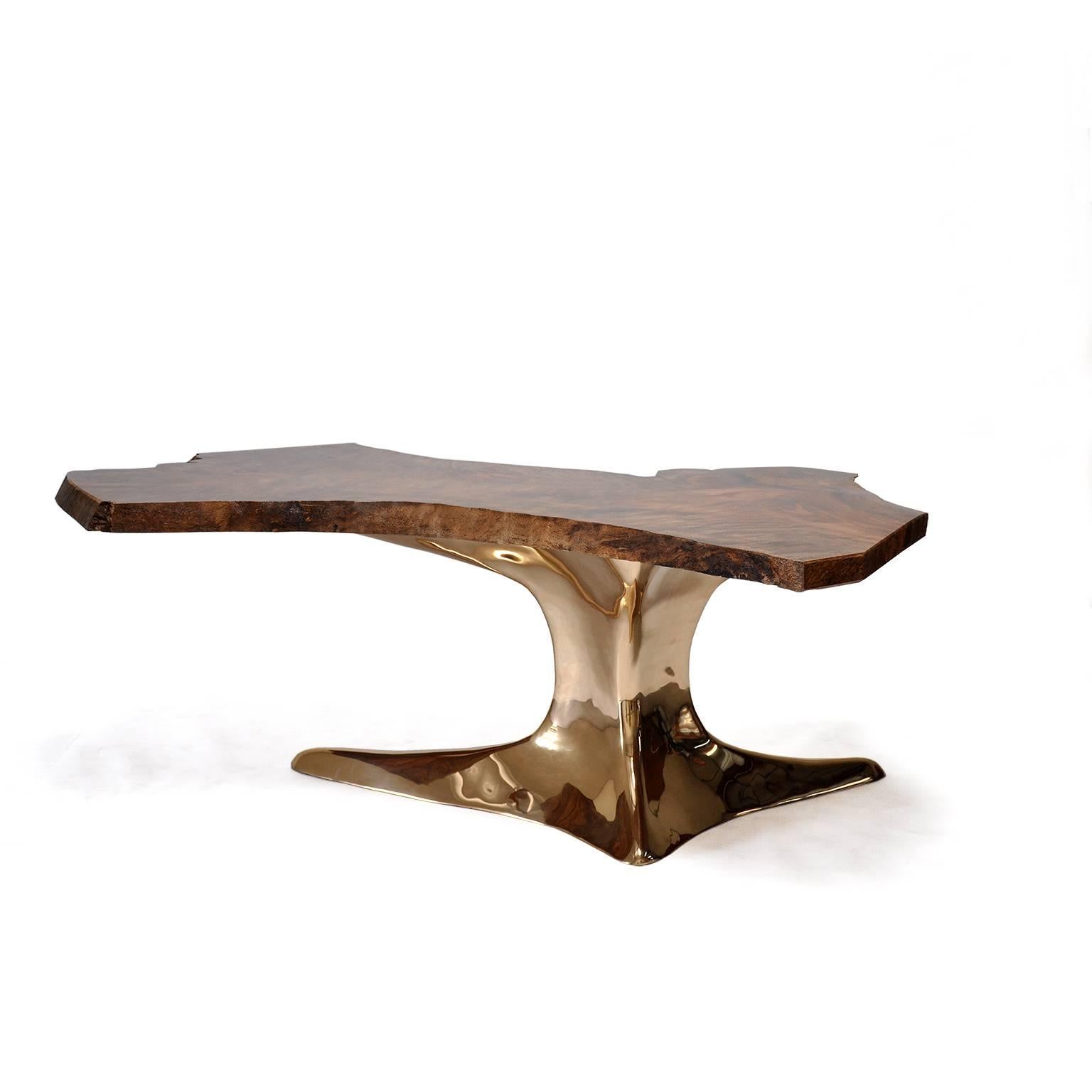 The root table is a celebration of the beauty of a naturally formed wood slab, elevated by a lustrous bronze sculpture base.

The bronze table base is identical from piece to piece, being cast from our own molds. The tabletop, however, will carry