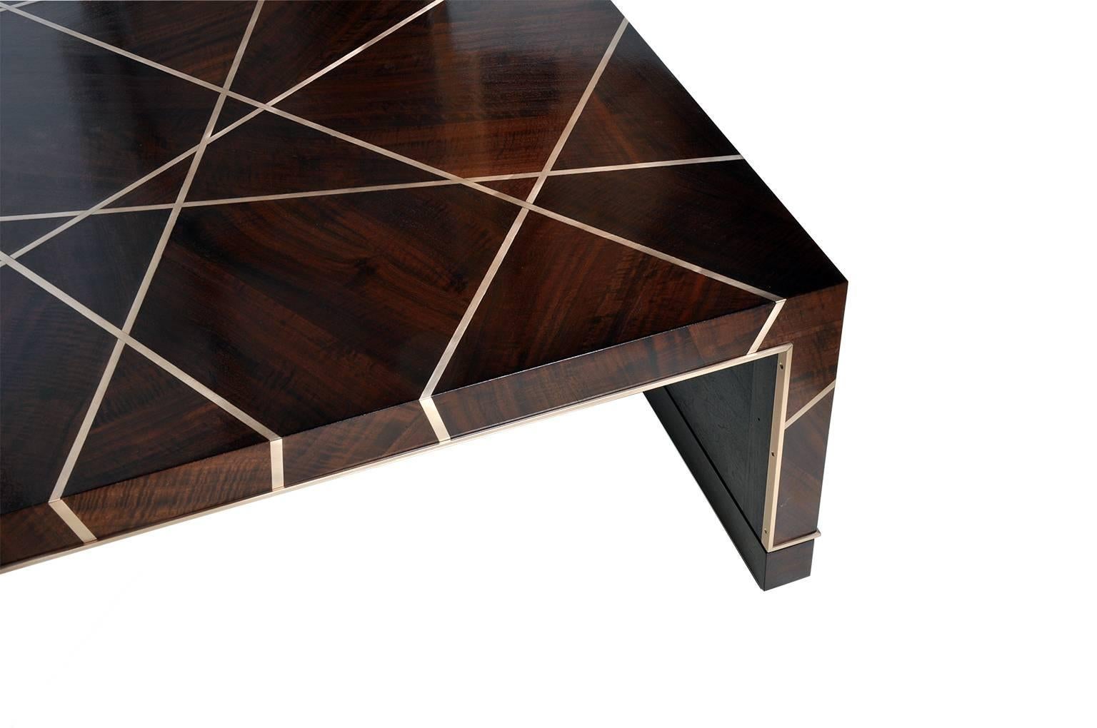 This ray cocktail table is the square version in this series, a geometric beauty and a wonderful piece of craftsmanship. It is made of Claro walnut, a California native species that has unique depth and rich tones. We have increased its color by