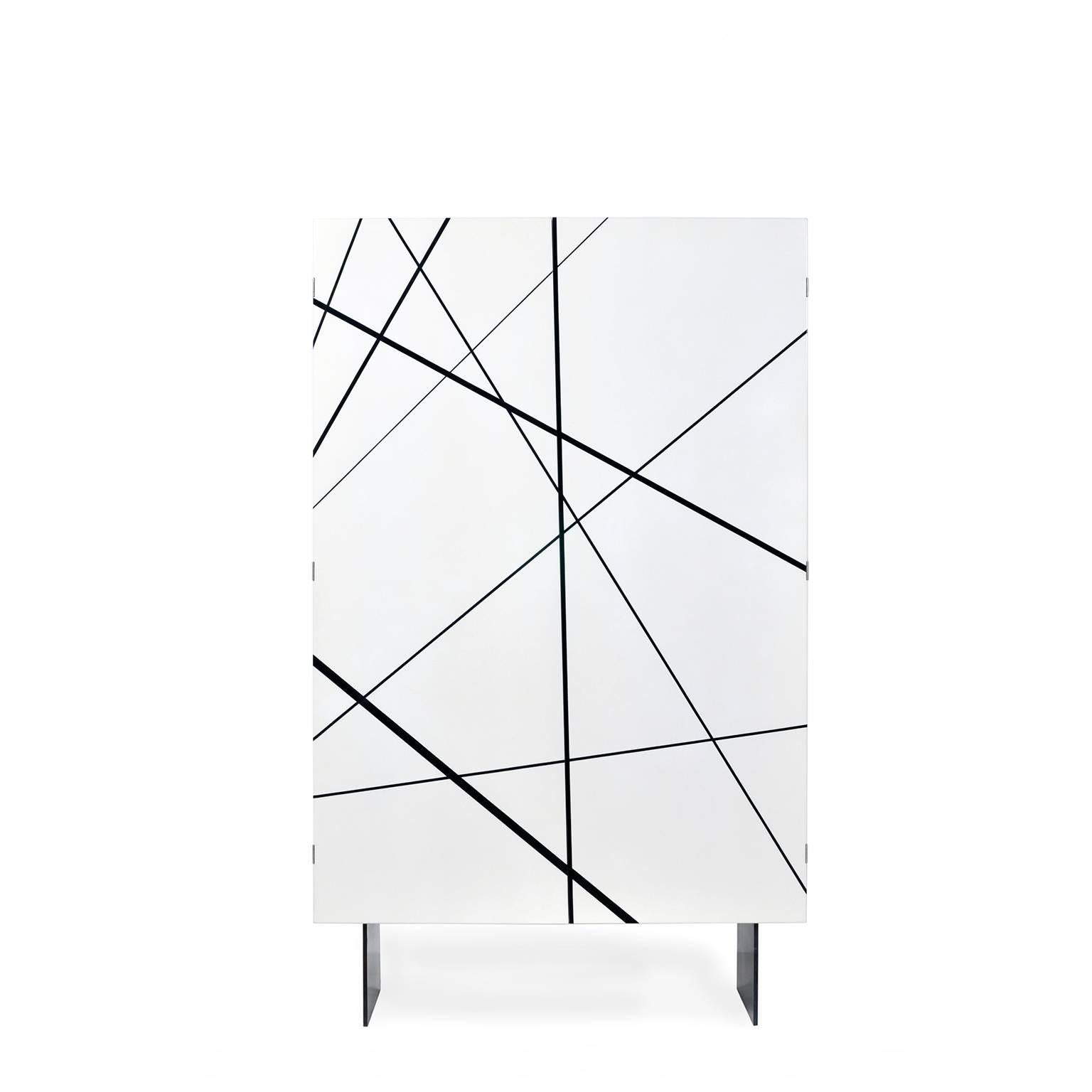 The ray cabinet in gloss white lacquer and Ebony inlay is a stunning artistic nod to modern and contemporary craft and design.

The graphic black-on-white surface seems simple enough from a distance, but upon closer examination, one discovers that
