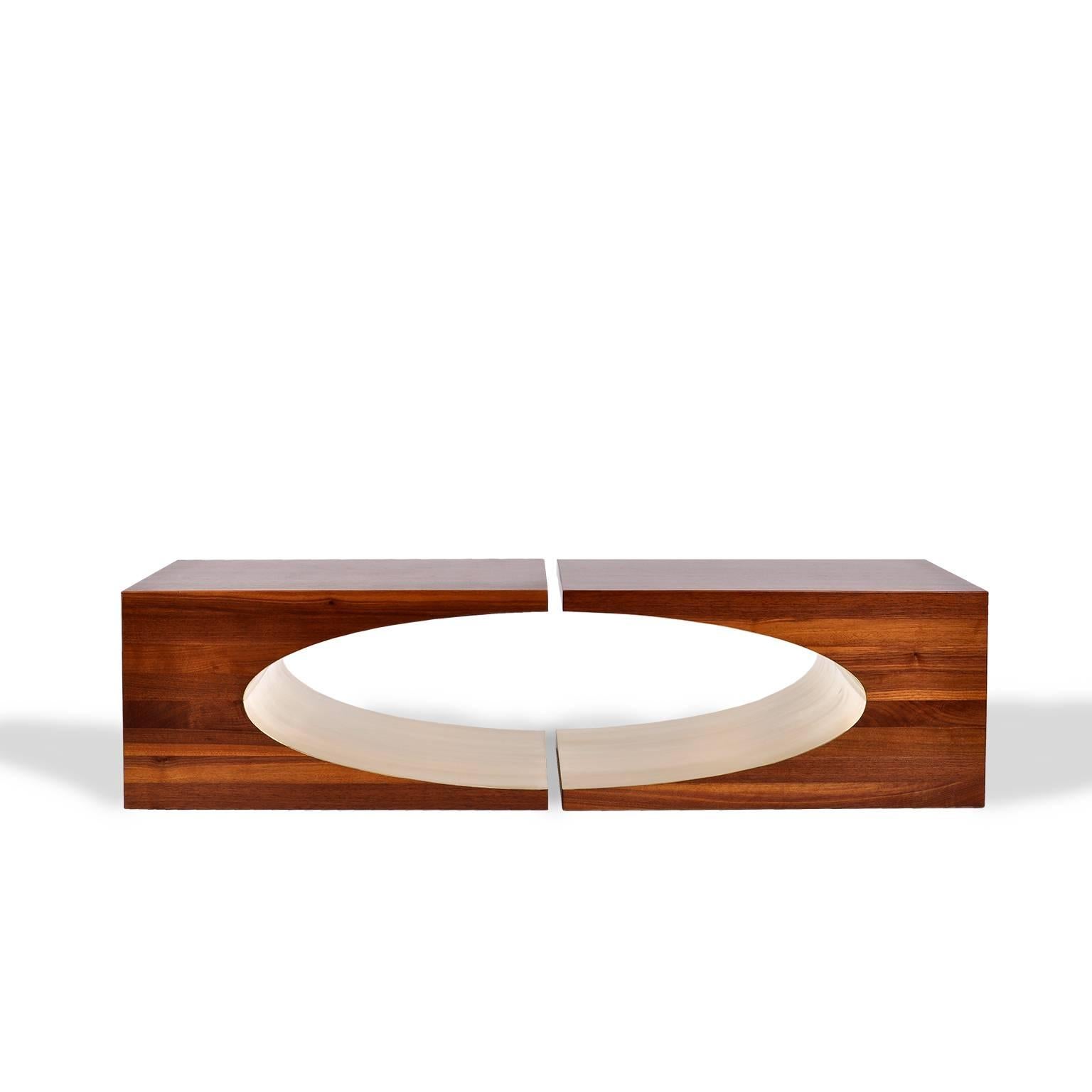 The Ellipse coffee table is the perfect pairing of two Ellipse end tables. The solid laminated walnut is carefully sculpted so the pieces work in both their use of positive and negative space.

The graceful, yet mathematical midsection of the