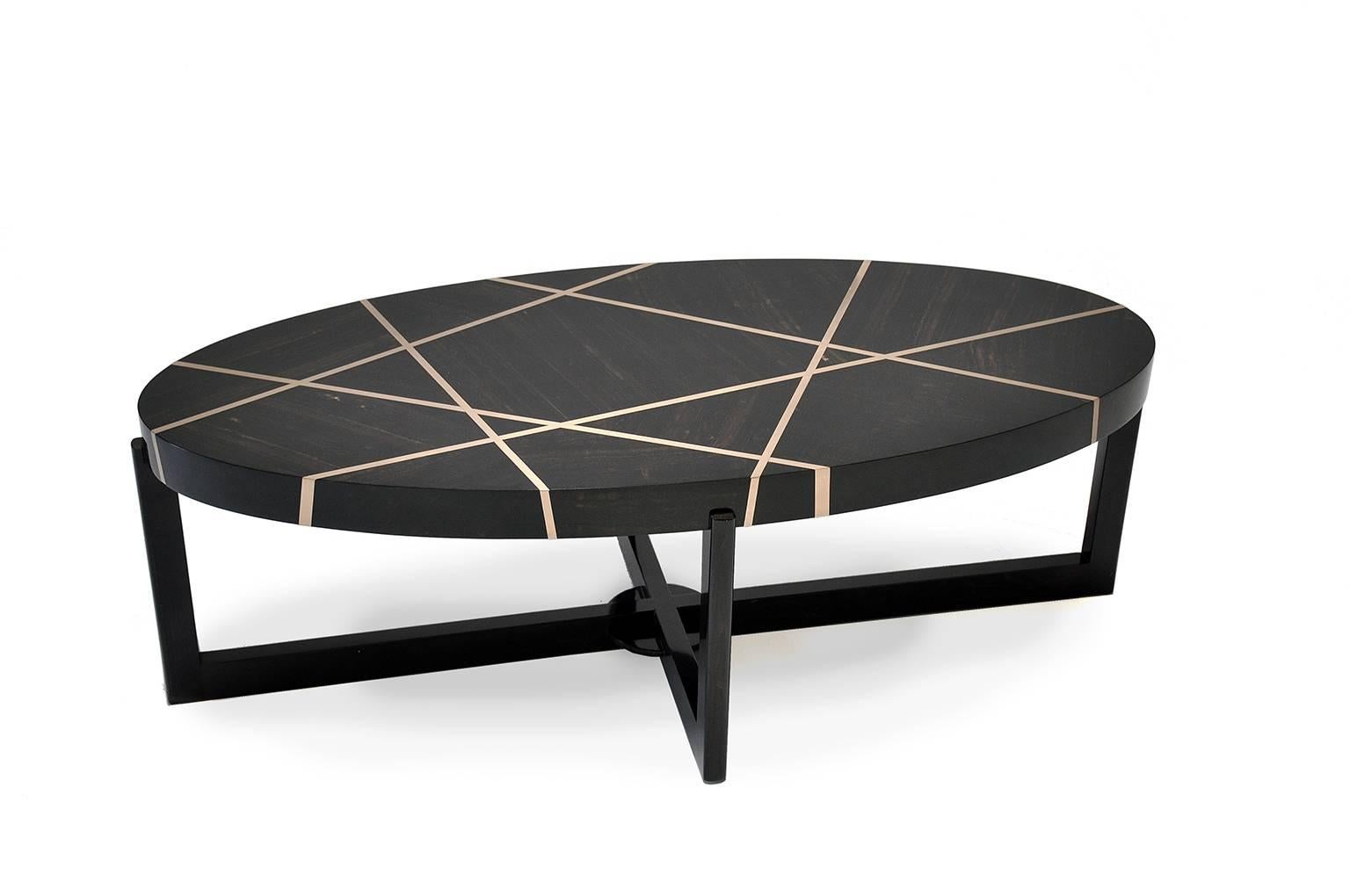 The ray cocktail table in ebony and bronze is created to be a notable piece. It is at once rich, luxurious and complicated, while maintaining a serious and serene form.

Gabon ebony is a member of the diospyros family and comes from northern