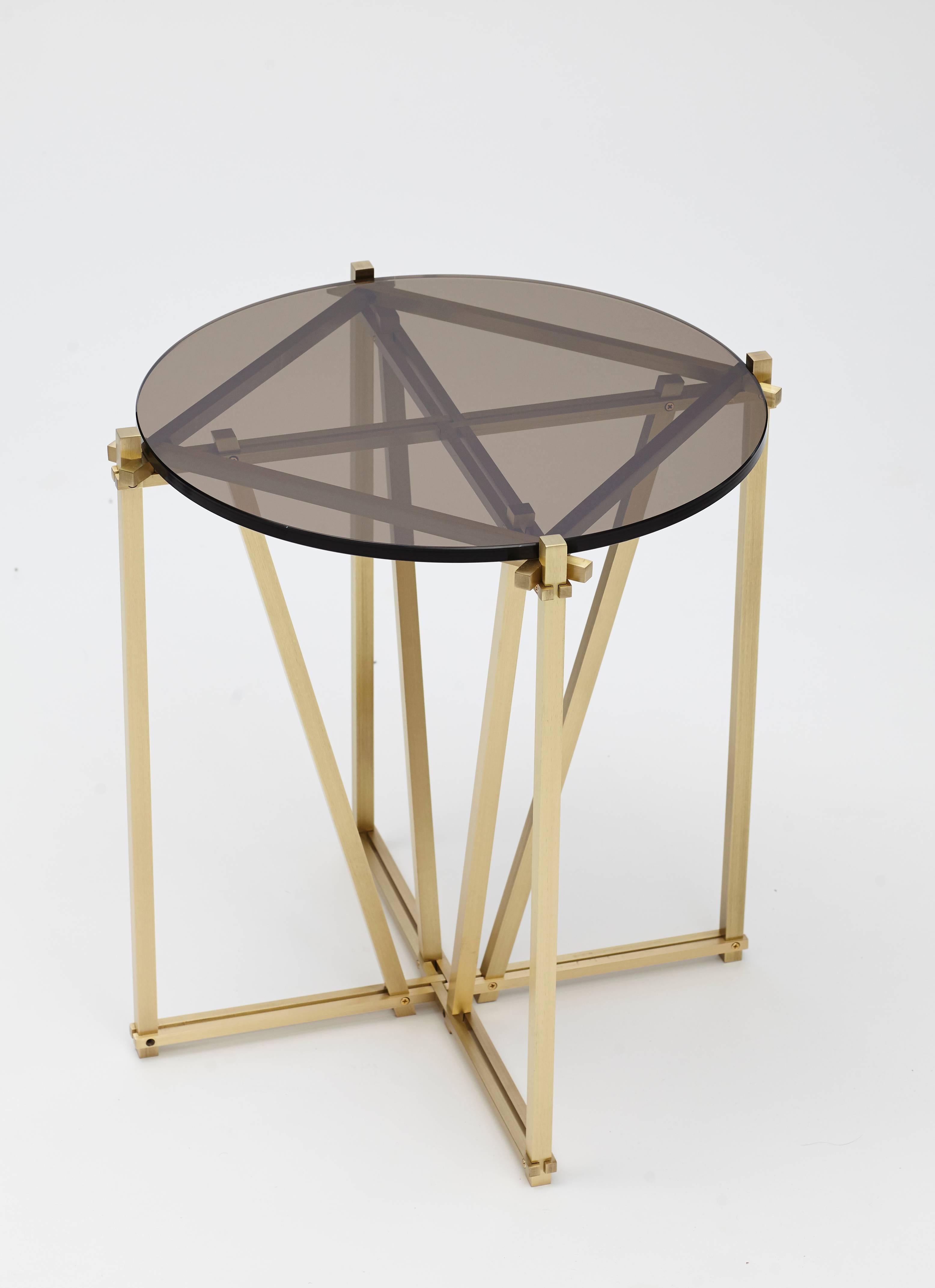 Based on the structural concept of the same name, the Tensegrity series evokes a complex yet elegant style by intertwining contemporary lines with contrasting metallic elements.

Intricate yet simple, the clear and smoked glass tops offer an elegant