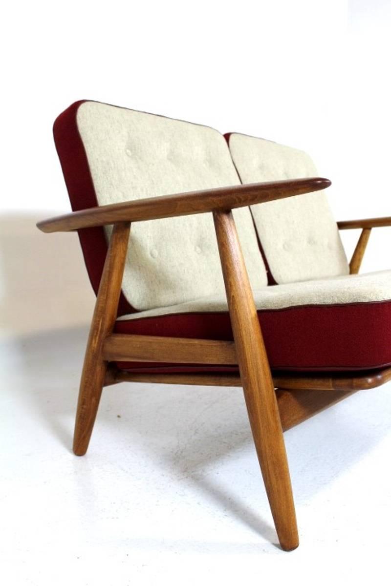 Two-seat cigar sofa GE240 designed by Hans Wegner for GETAMA in Denmark. Its with spring cushions. Needs new upholstery. The wooden frame in beech is restored and in very good condition.
Please don't hesitate to contact us with any question.