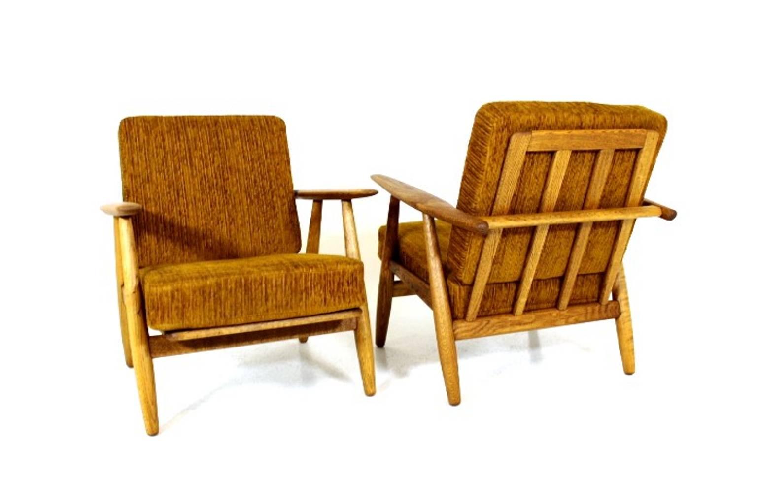 Scandinavian Modern Pair of  Hans J Wegner Cigar Lounge Chairs Model GE 240 in Oak and Fabric
