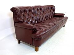 Three-Seat Sofa in Dark Red Leather  by Arne Norell for Möbel AB Arne Norell