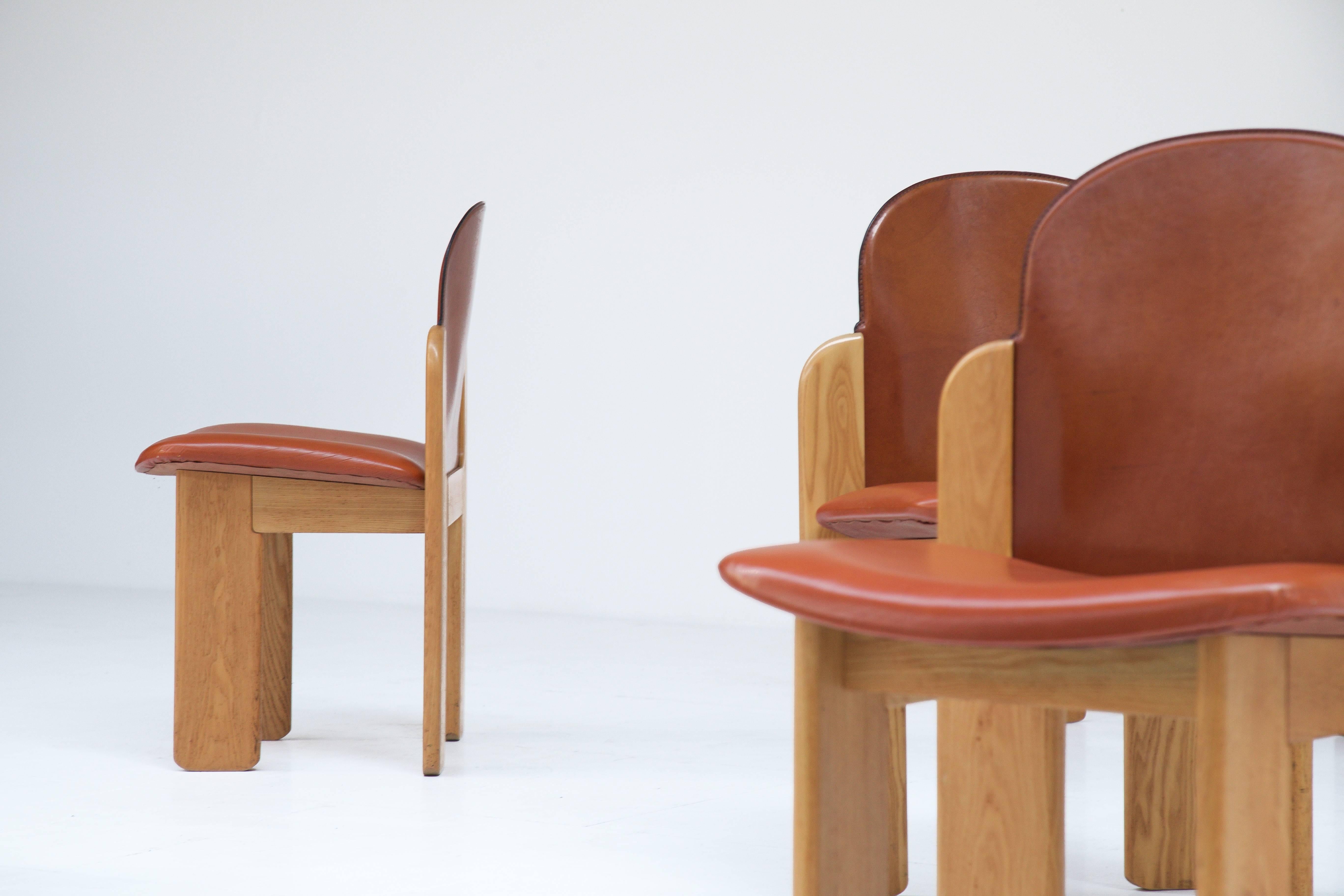 Six ashwood chairs, seat and back upholstered with reddish brown leather. Manufactured by Montina, Italy, 1970s. Super condition!