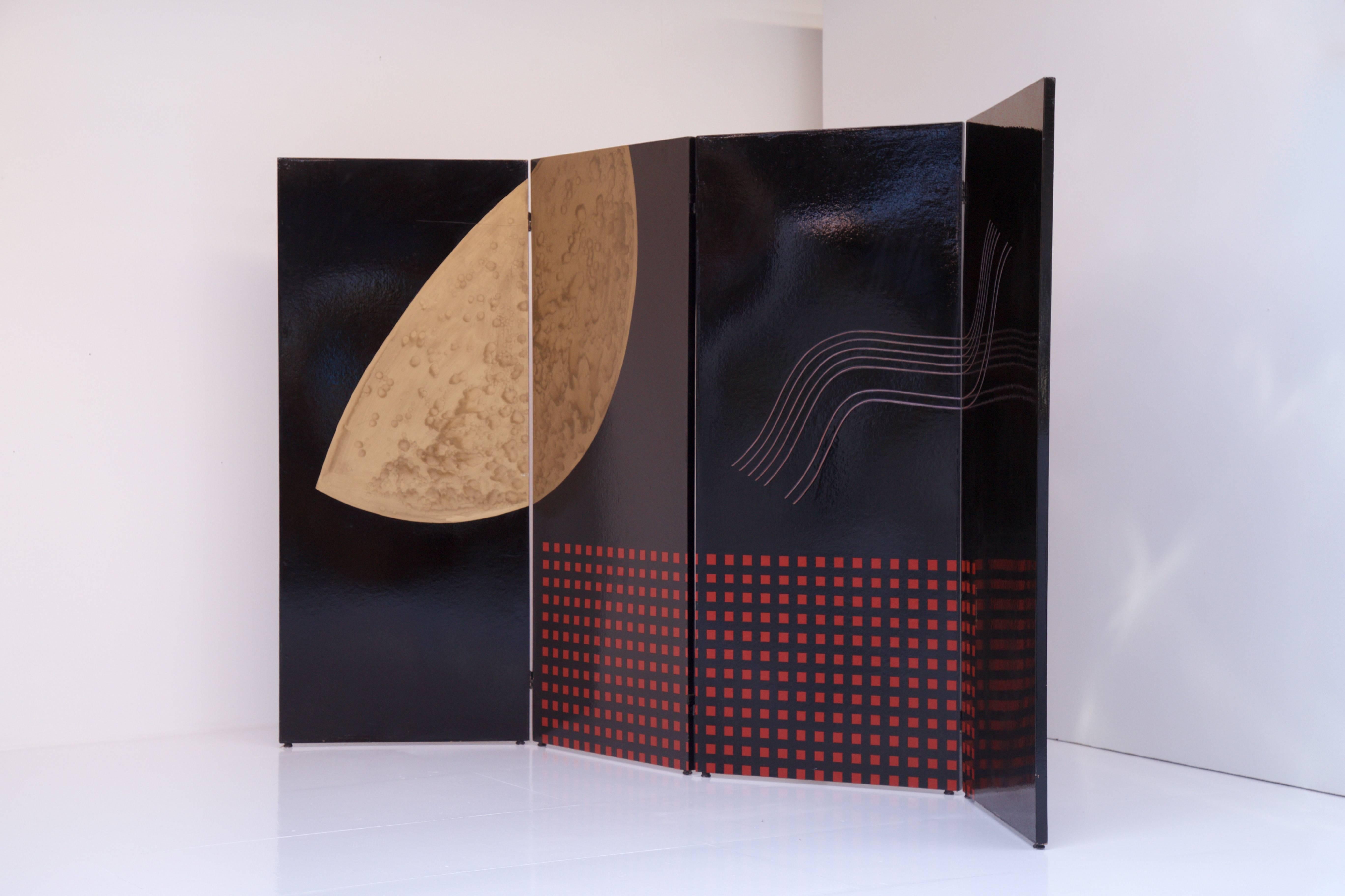 Fantastic intergalactic lacquered room divider which pictures a moon like form, red squares and a relief wave form. The moon and red squares have been painted on the painted black lacquer, while the wave forms have been incised in the panel. The