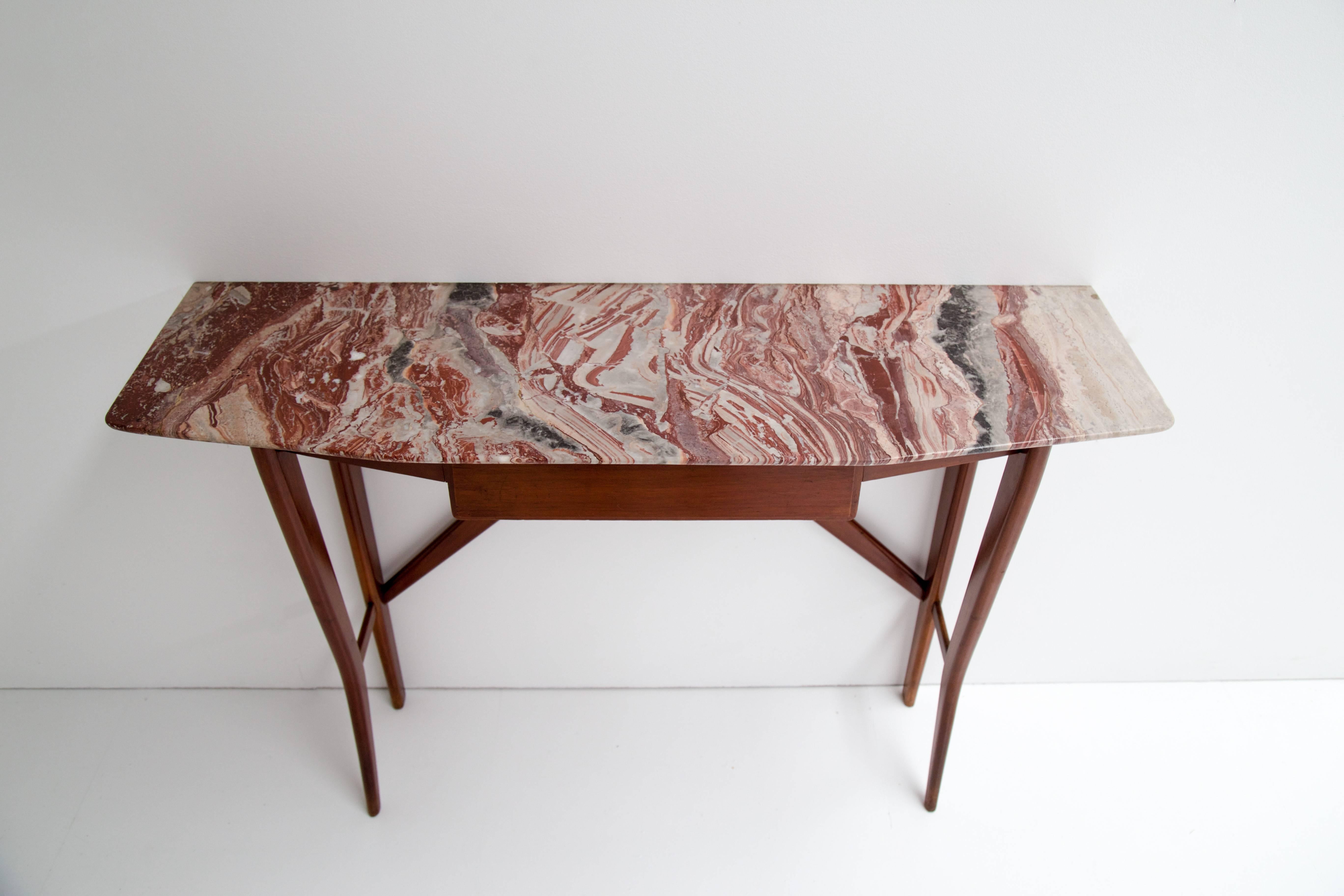 Very elegant Italian console with one drawer, in marble and wood. The marble has a really fantastic multi colored drawing in grey, red, pink, blue and white. One of the most exquisite marble tops I've seen.