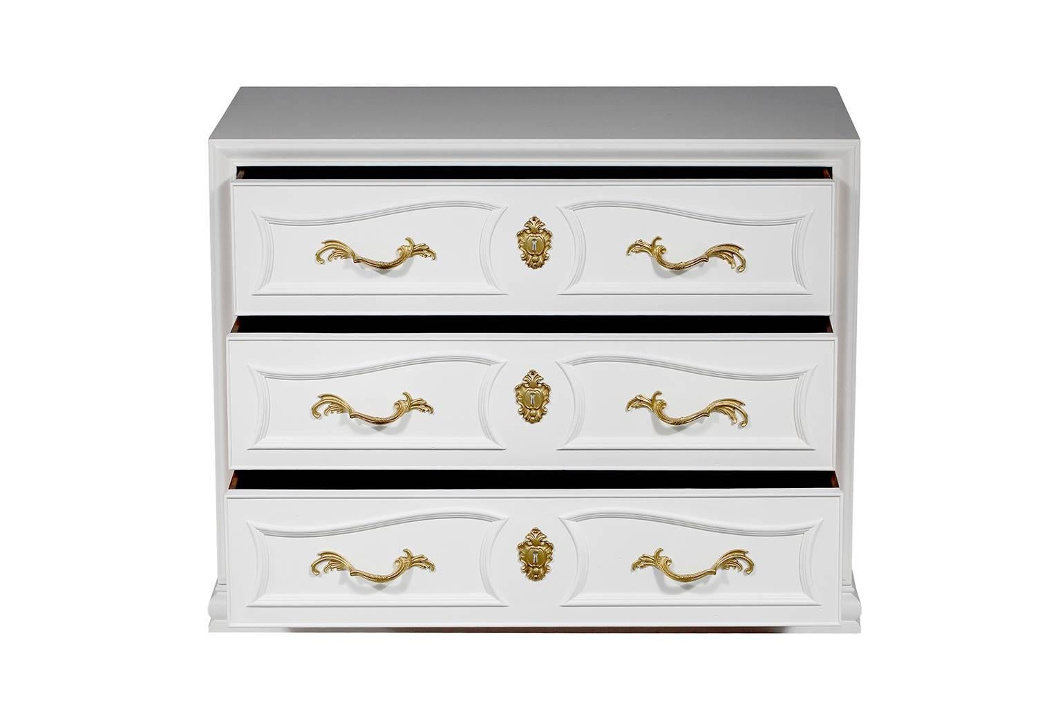 Pair of vintage French-style Henredon chests newly lacquerd in white with brass hardware and three drawers each.
