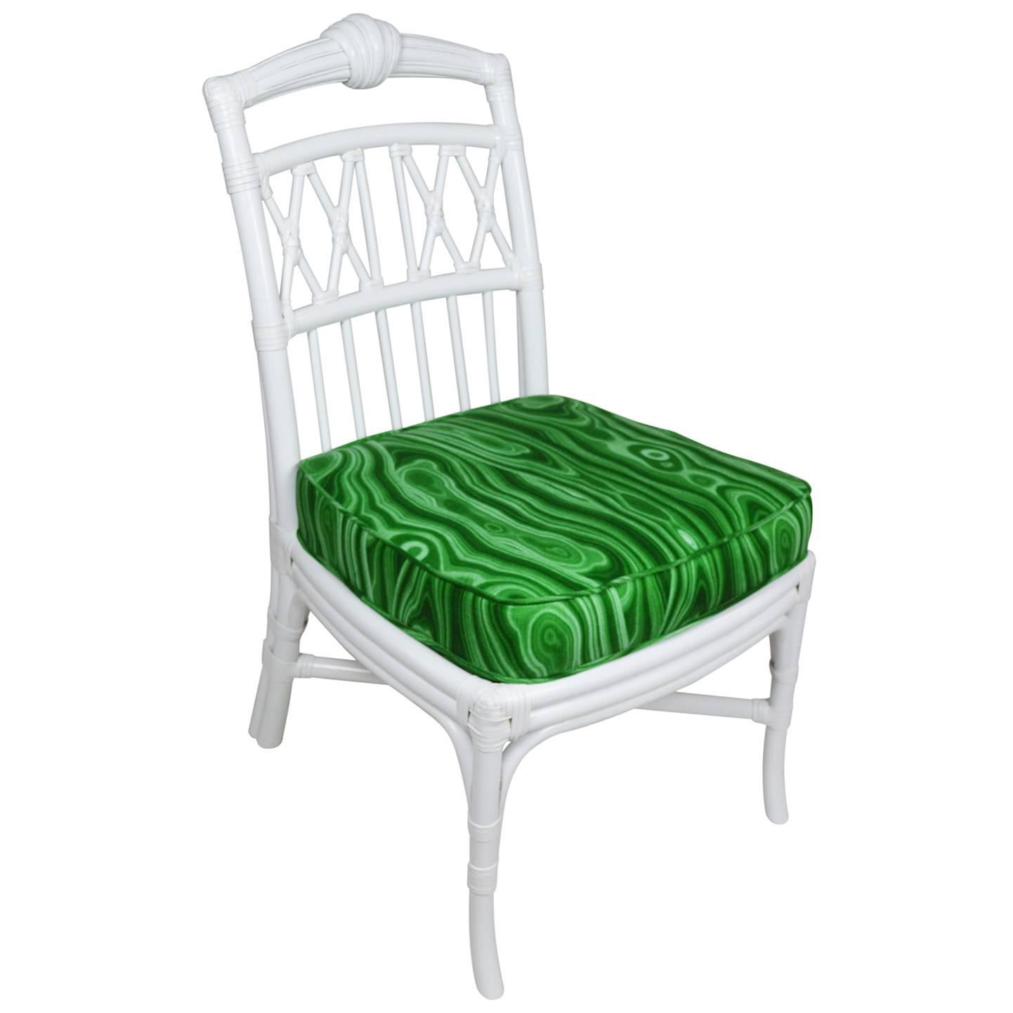 Set of six Ficks Reed side chairs newly lacquered in white. The rattan frames have a lattice back and leather windings. The seat frames and new cushions are upholstered in Robert Allen malachite print.