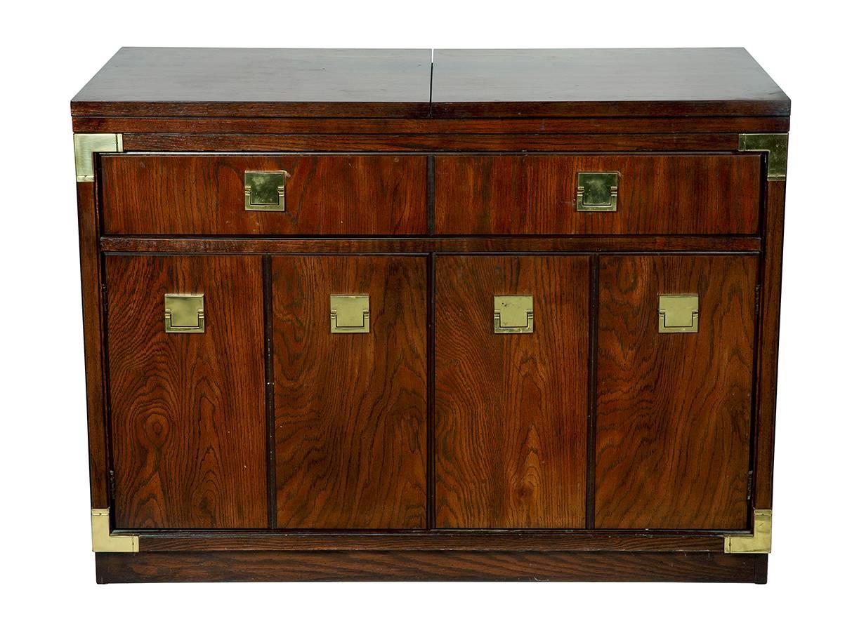 Vintage flip-top server by Thomasville with drawer an two door cabinet on caster wheels. The top flips open (20w each side) to a black lacquered finish.