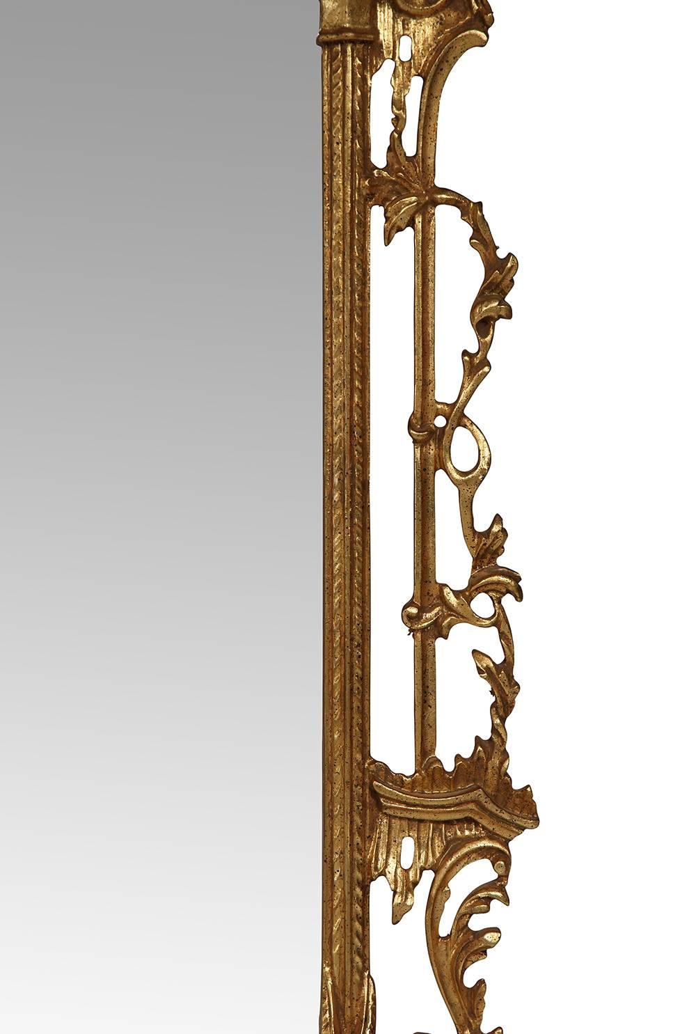 Vintage Italian gilt Chippendale mirror adorned with a finial and five delicate bells. The frame has elaborate scrolled leaf carvings and ornate corners. Hooks on the back for hanging. Marked 