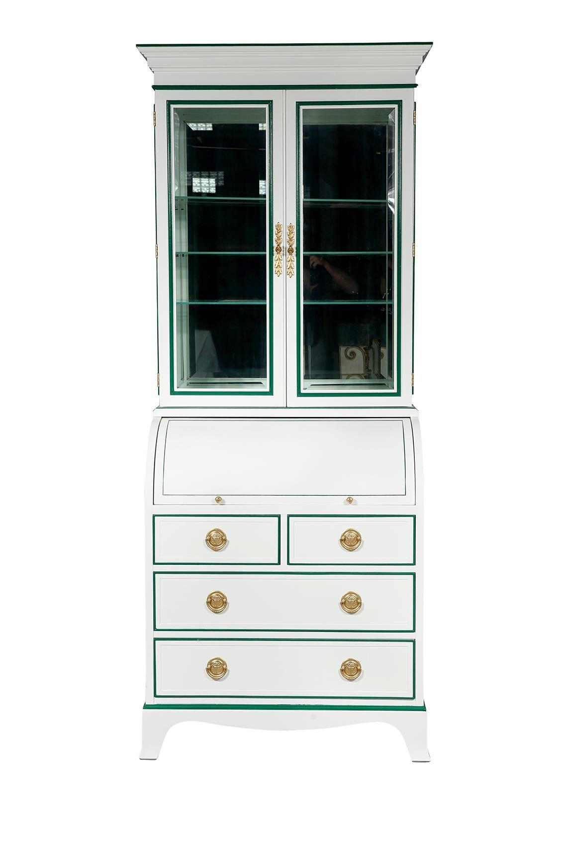 Vintage Heckman secretary newly lacquered in white with green interior and detailing. Beveled glass doors open to three glass shelves, mirrored back and malachite fabric bottom. The roll top opens to faux-leather writing surface, cubbies and drawer.