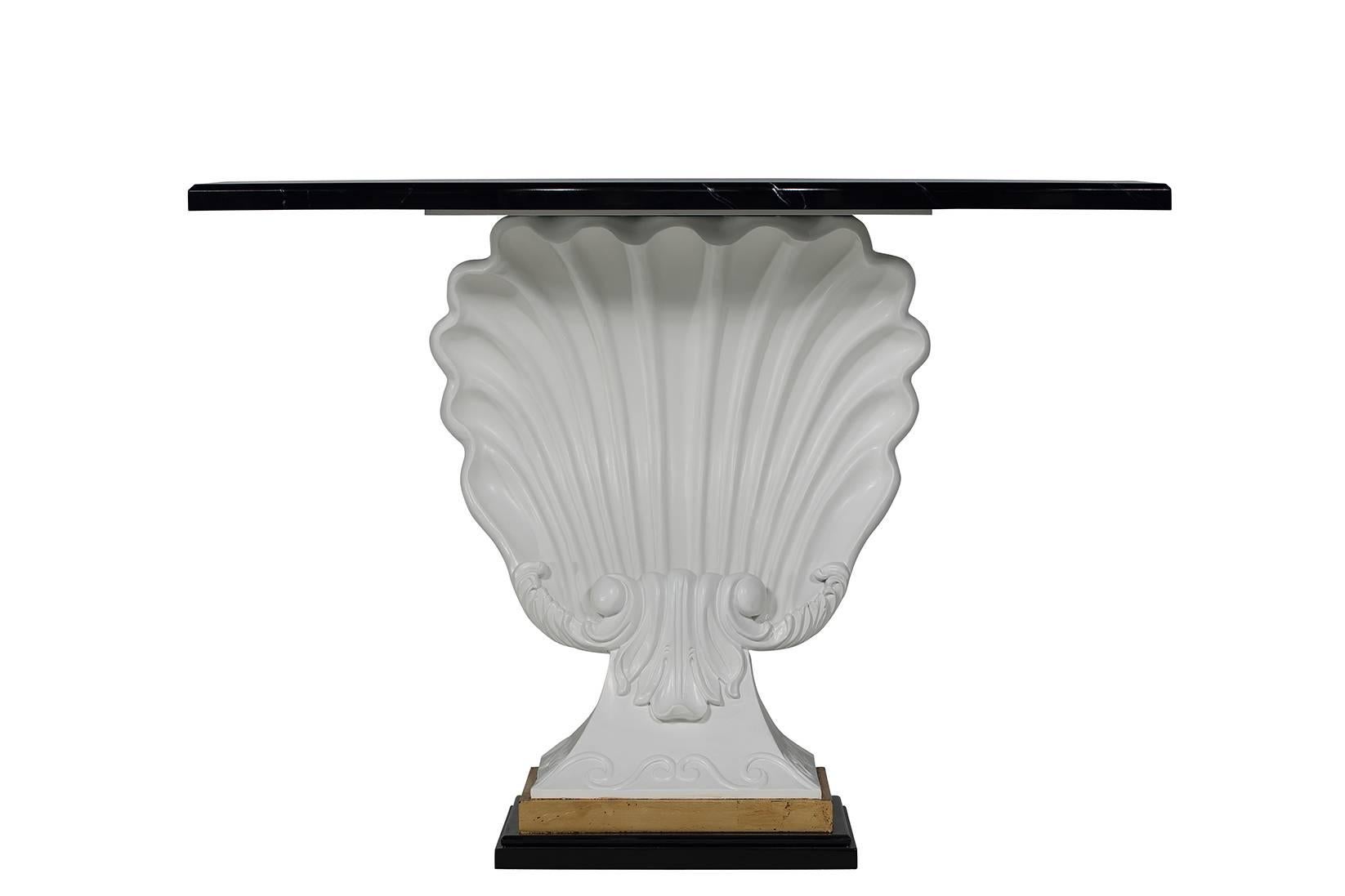 Shell motif console table in the likeness of Grosefield House. The black-faux marble top attaches to a shell base with 24-karat gold leaf detailing.