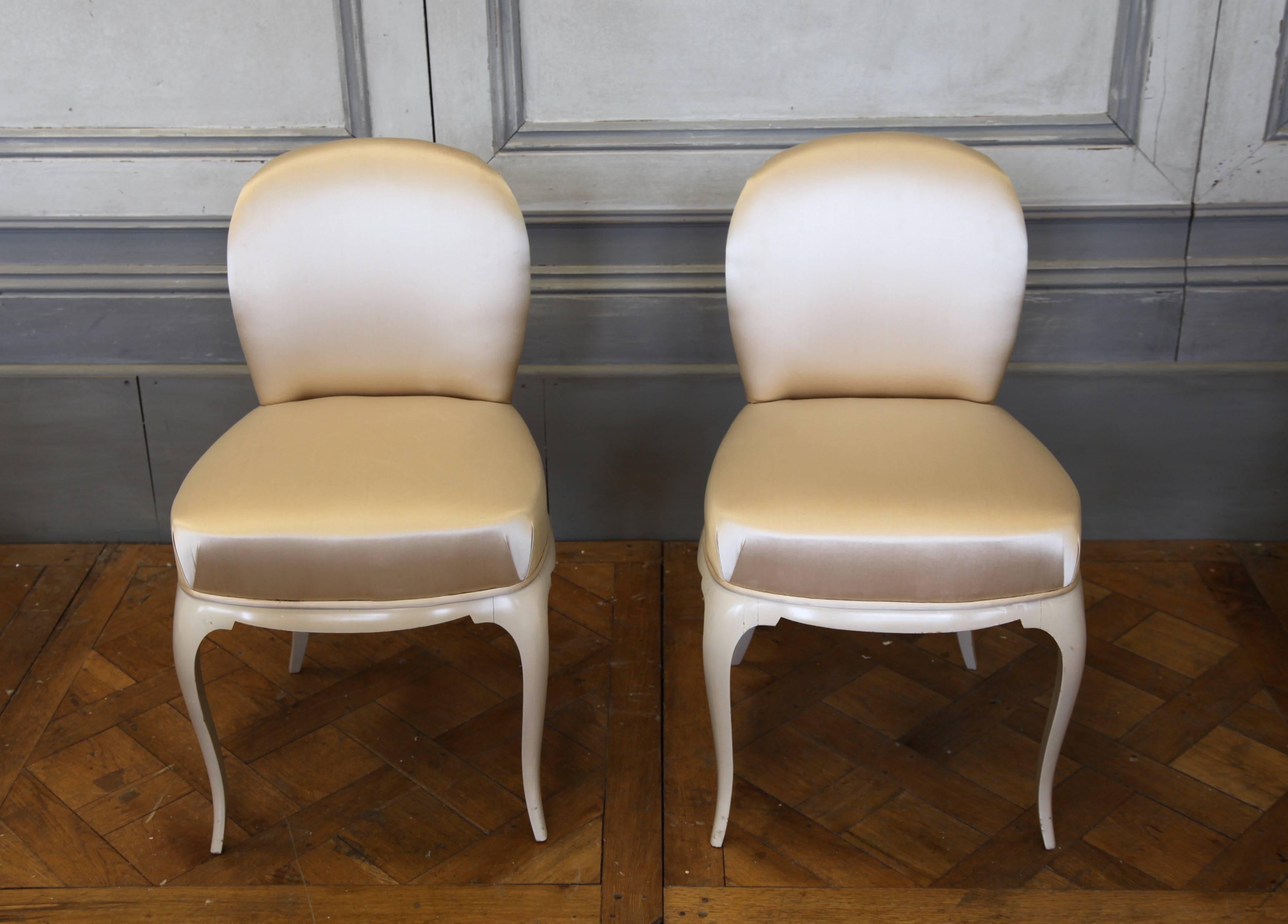 An original, pair of René Prou chairs, circa 1930s. Finished in the original Art Deco, dusky pink lacquer and upholstered in a complementary pale, shell pink (as picture). In lovely condition.