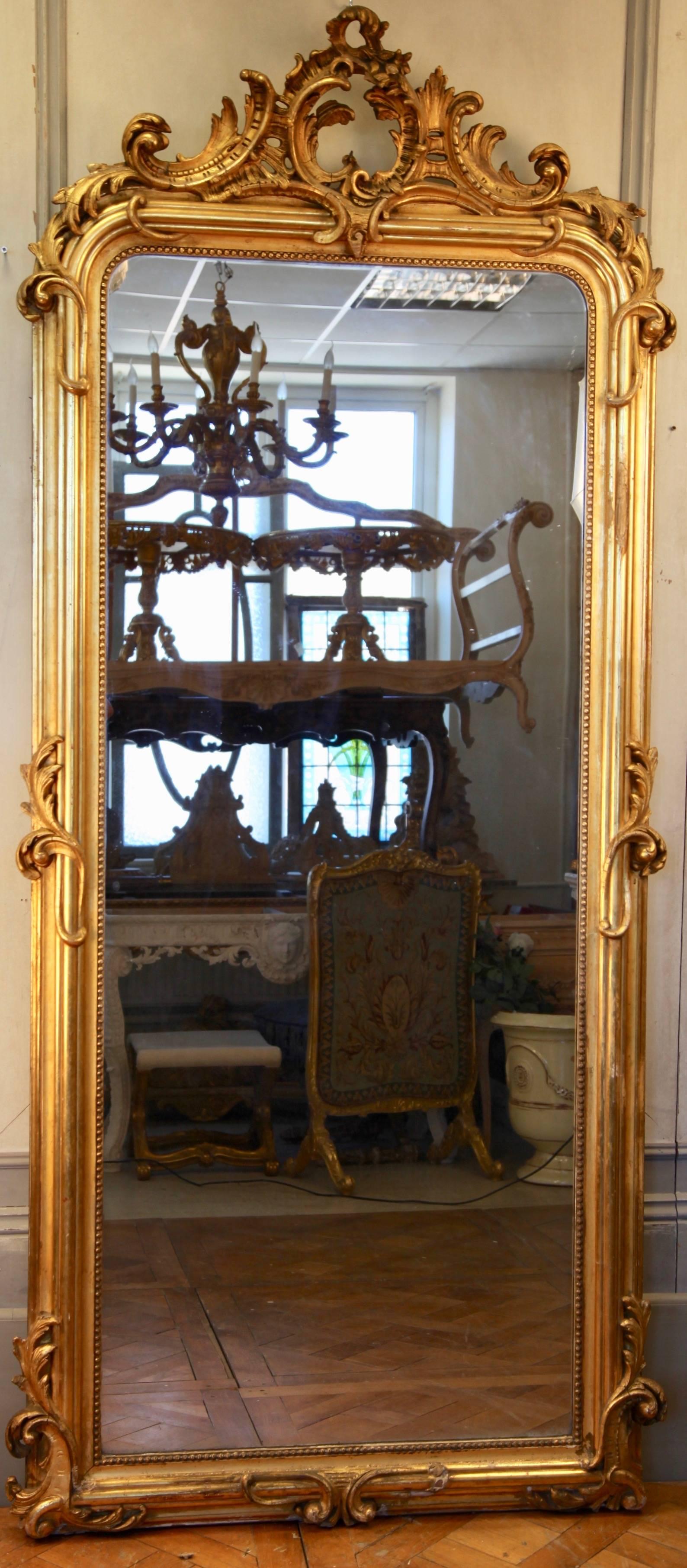 Beautifully proportioned, 19th century, French gilded mirror with original antique glass. Can be used as a floor standing or wall-mounted piece.