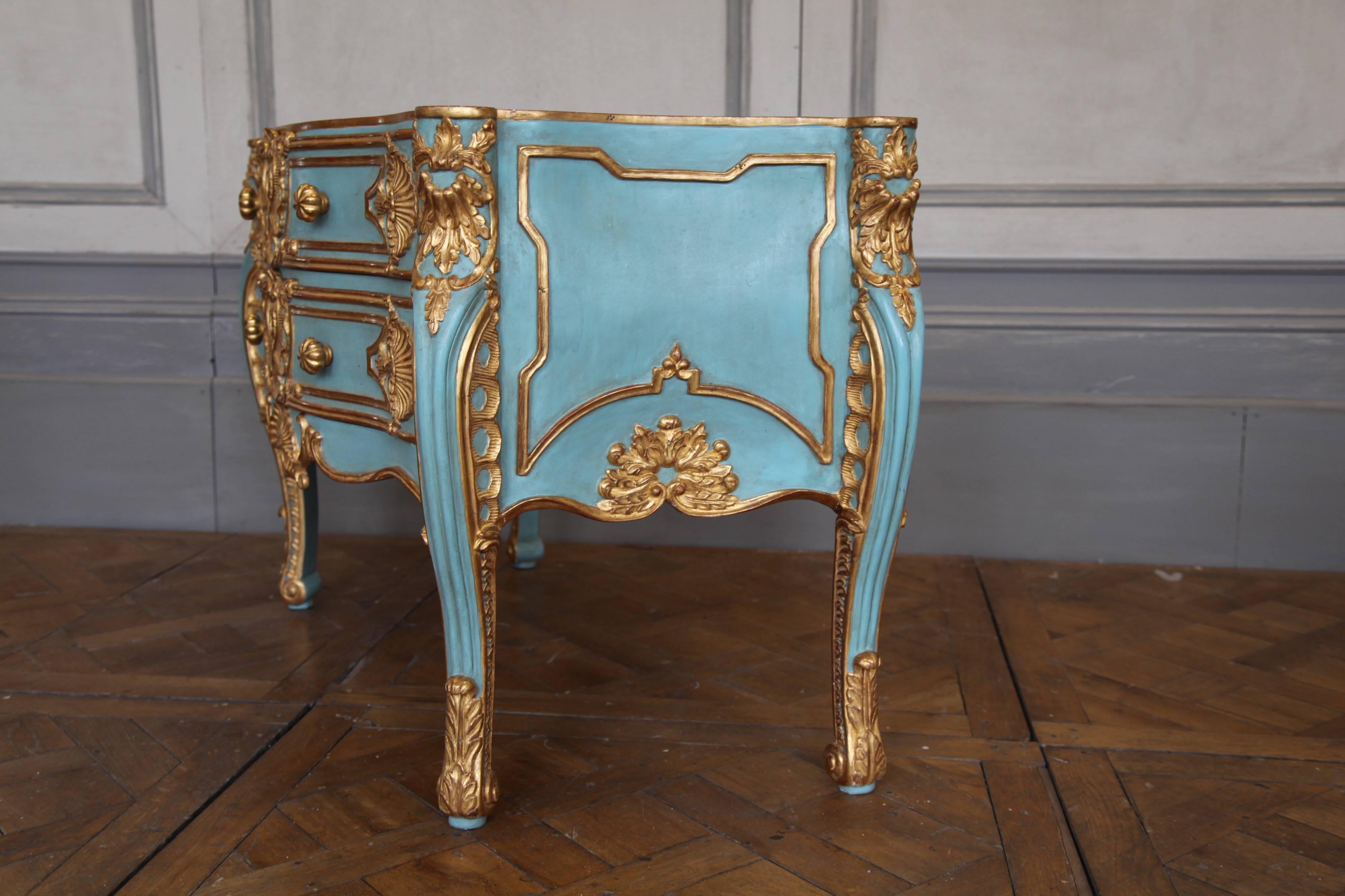Italian baroque style commode: Hand-carved by master craftsmen and hand finished in an aged polychrome gilded and turquoise patina using traditional methods and materials. A bevelled marble top for this item can be made to order from our selection