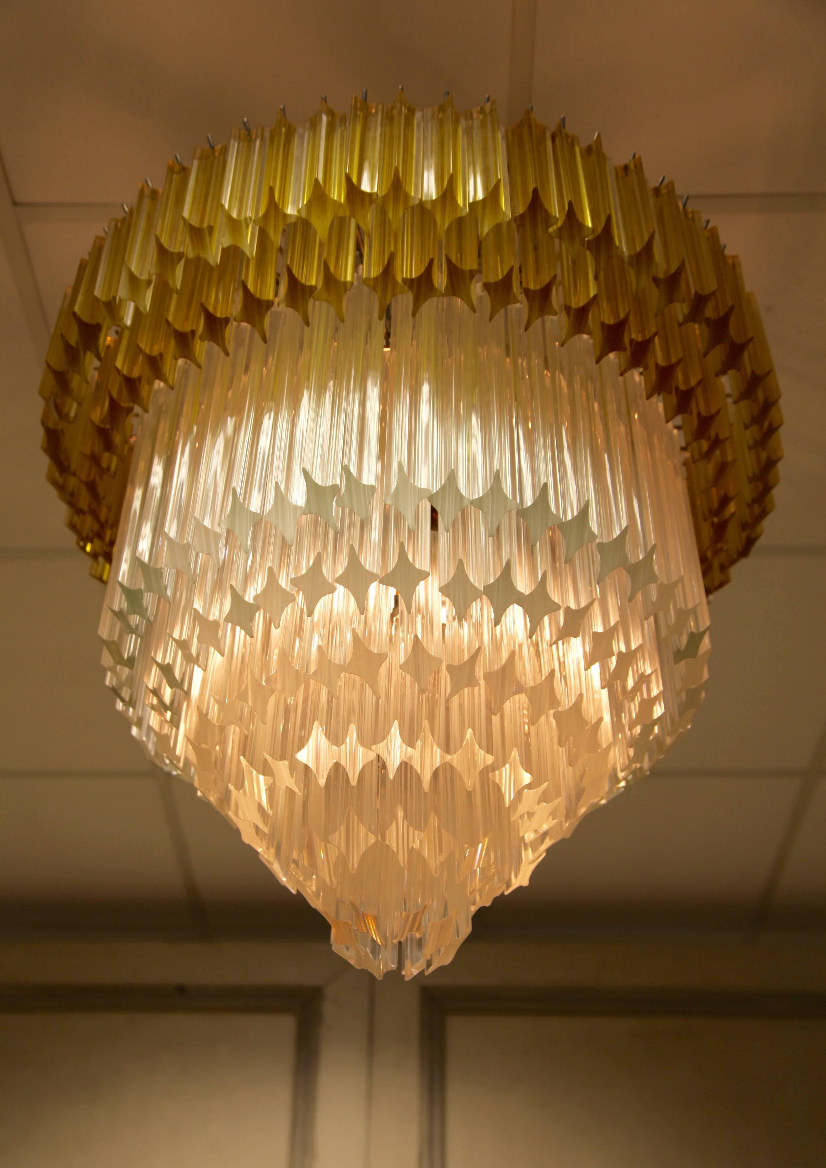 Statement, Vintage style Murano chandelier. First six tiers are made in transparent crystal and the final two in a golden yellow hue. Casts a warm glow.