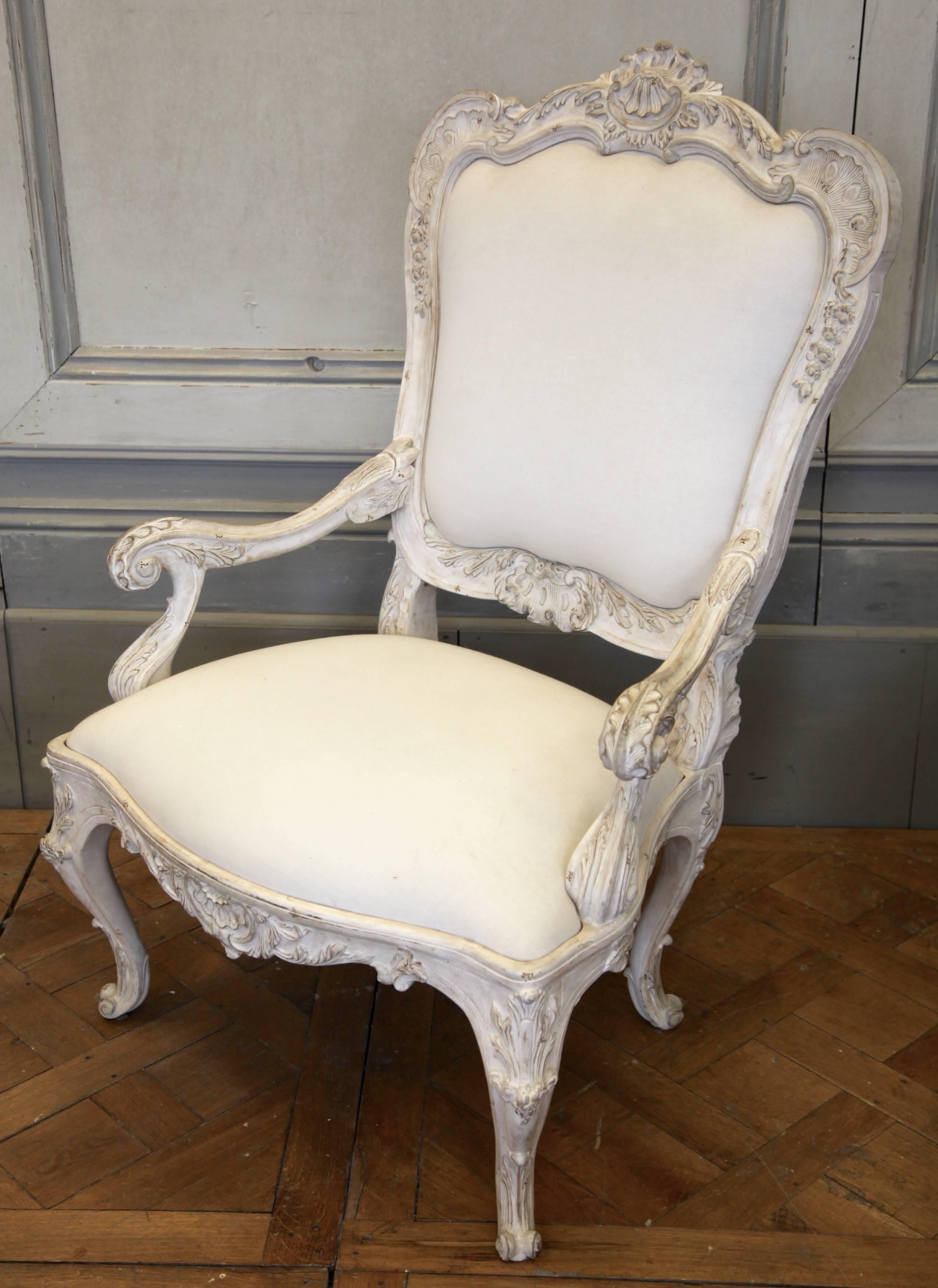 Re-edition of an 18th century Venetian armchair, hand-carved with beautifully crafted detailing. Hand finished in a gesso white patina, aged and distressed.