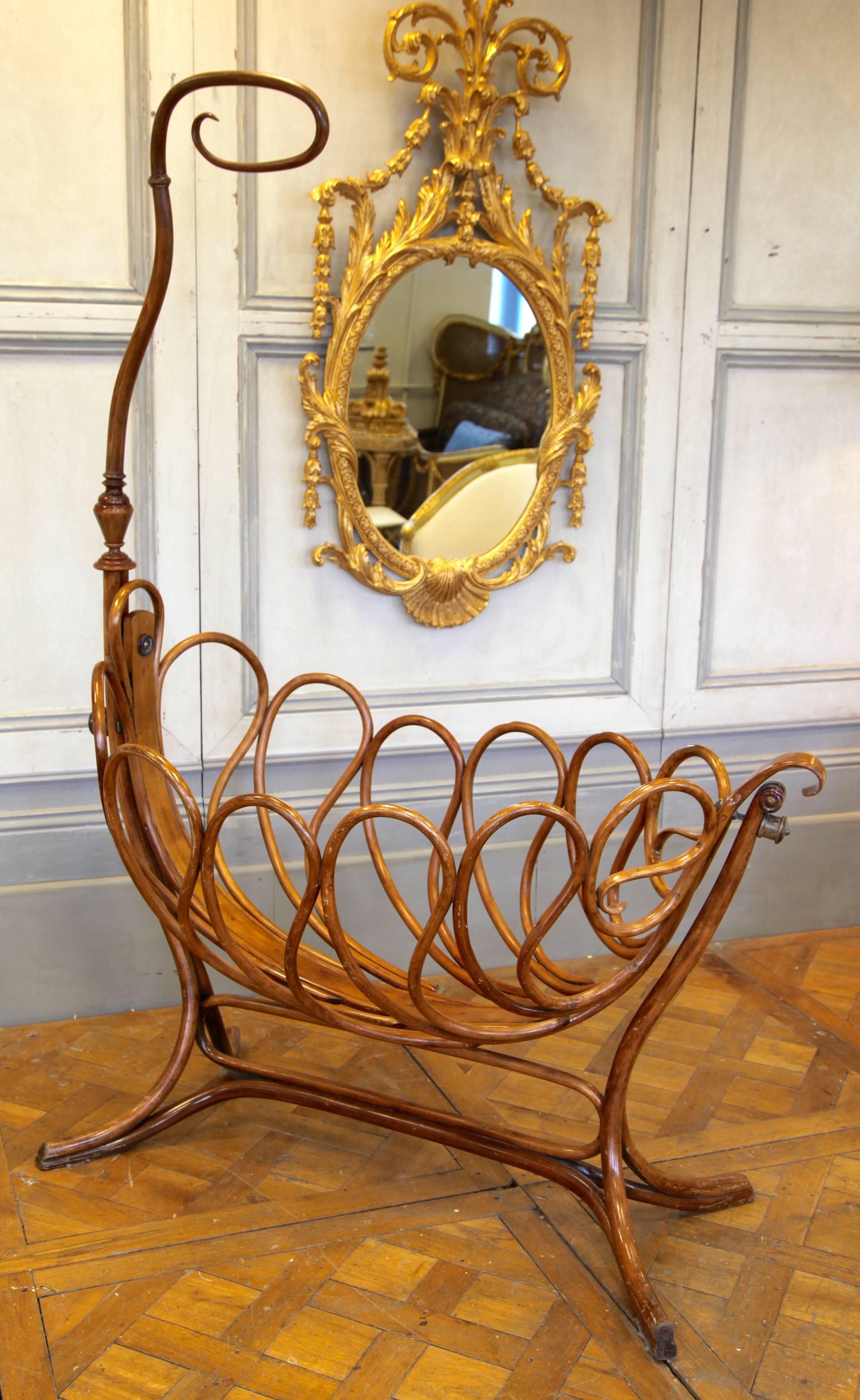 This French bentwood cradle made in the Thonet style is a rare find, circa late 1900s. The cradle is in perfect working order with a gentle rocking action which can be blocked by a round handle (seen at the back) when required. A mattress can be