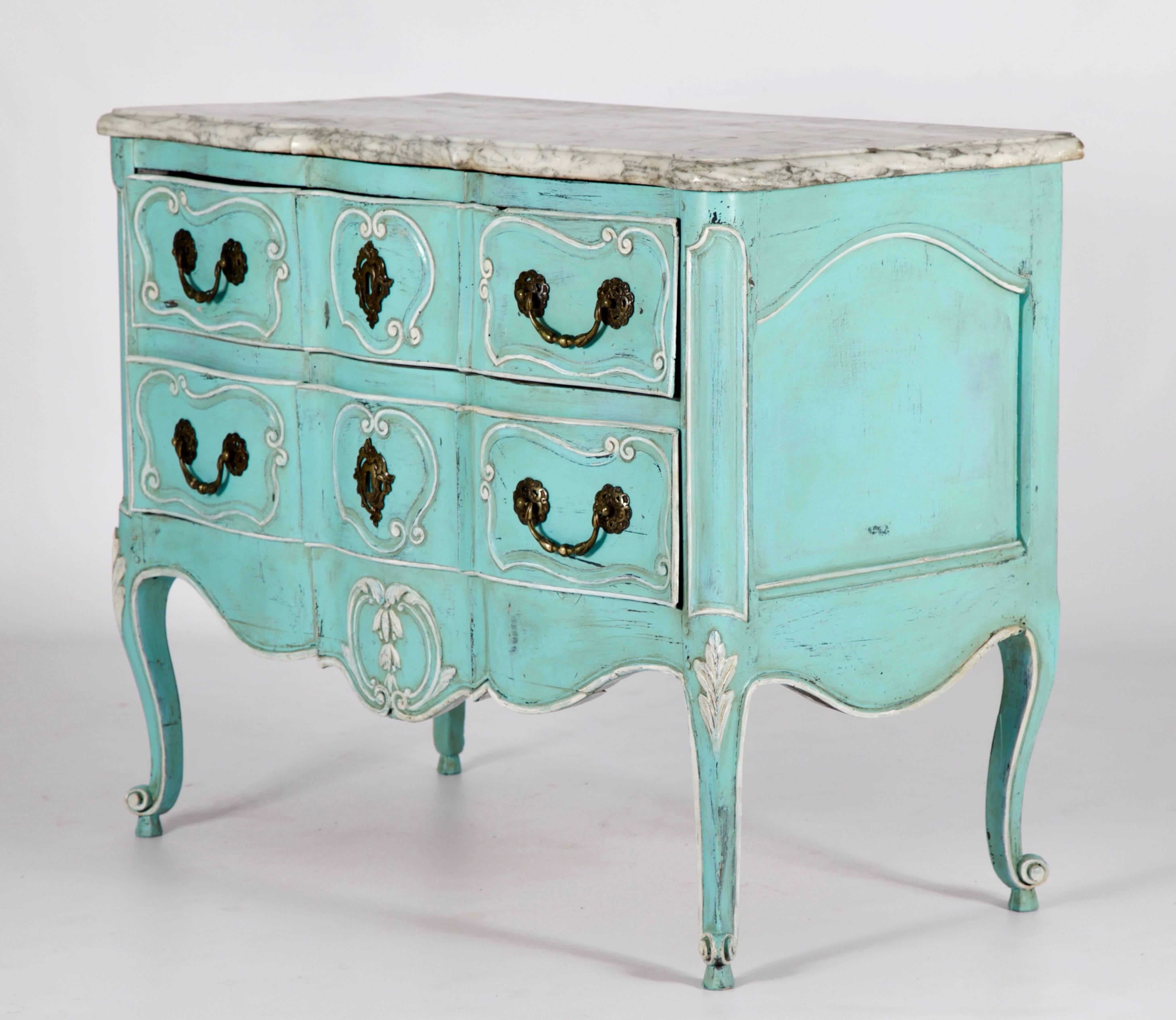 Early 19th century Louis XV style commode with Provençal carving. Finished in a turquoise patina with Ecru white highlights, aged and distressed. Topped with the original beveled and shaped Carrara marble of generous depth.