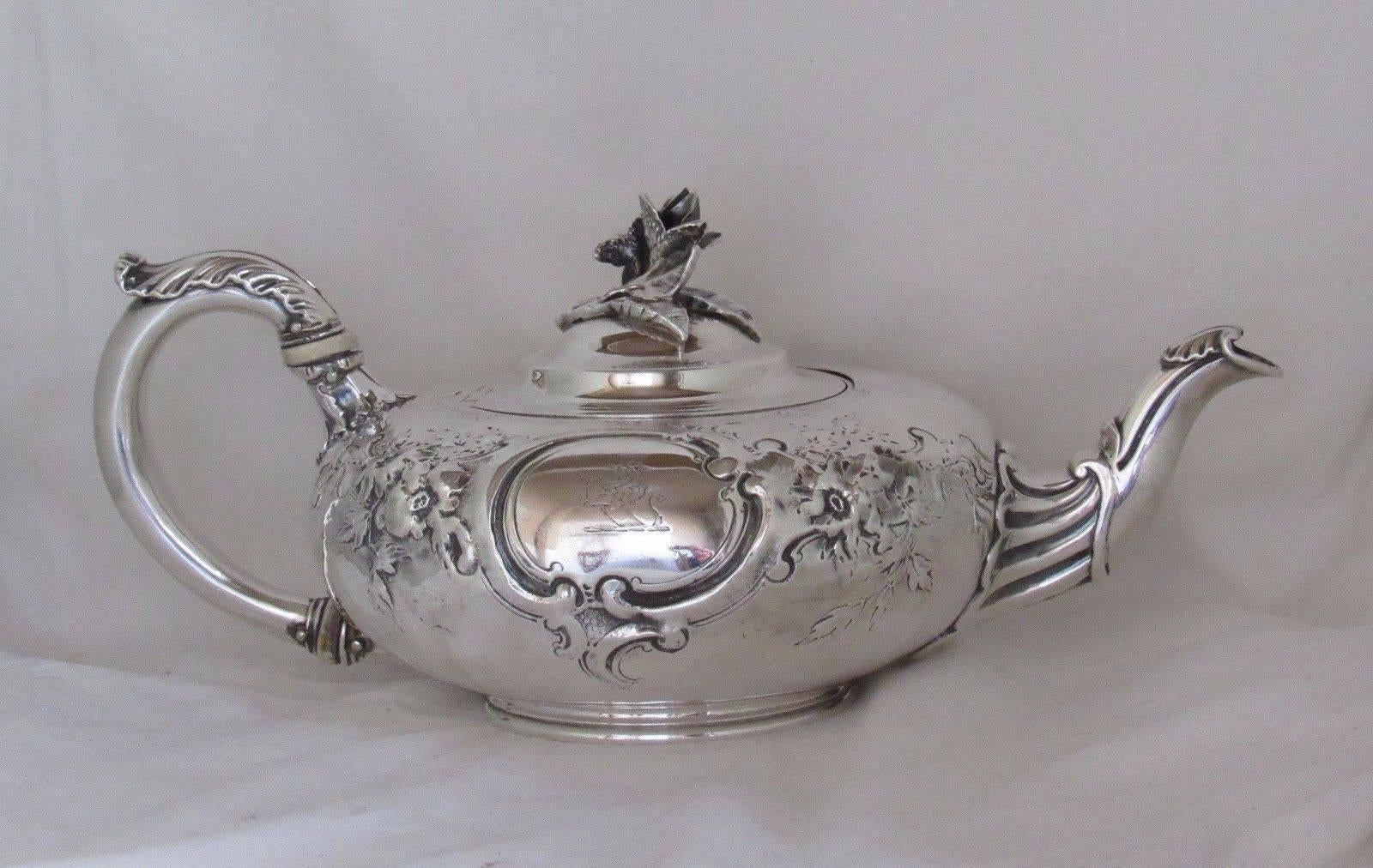 Gorgeous Paul Storr English sterling silver teapot.

William IV, London 1831 date mark, PS maker's mark, and marked Storr & Mortimer. Fully marked on bottom, marked under lid, and on handle.

Floral repousse with engraved lion and sword crest.