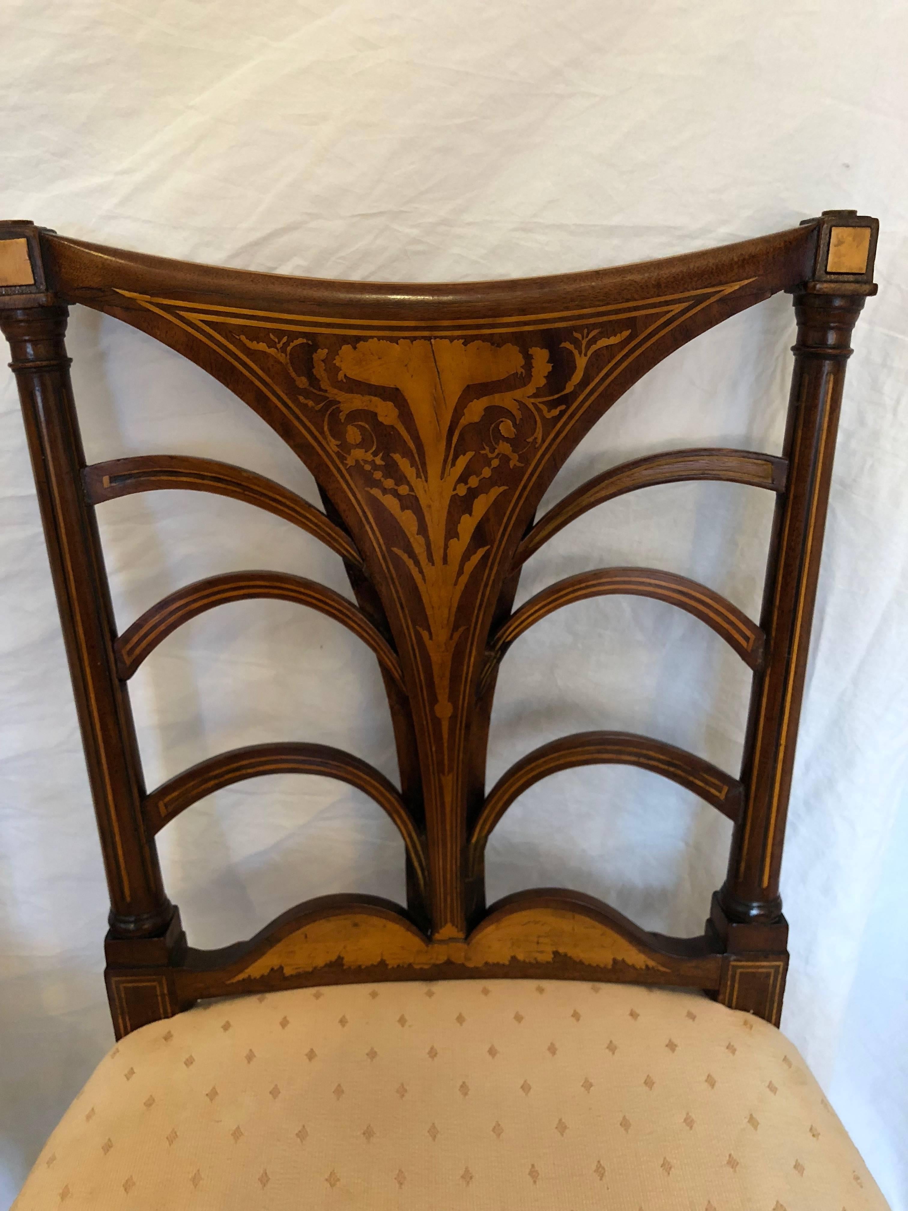 Set of 6 English Regency dining chairs

First half 19th century, circa 1825 

35" high, 20" width, 17" deep, 19" seat hight 

Chairs are in good overall condition with small cracking in the inlay and old nail holes from previous