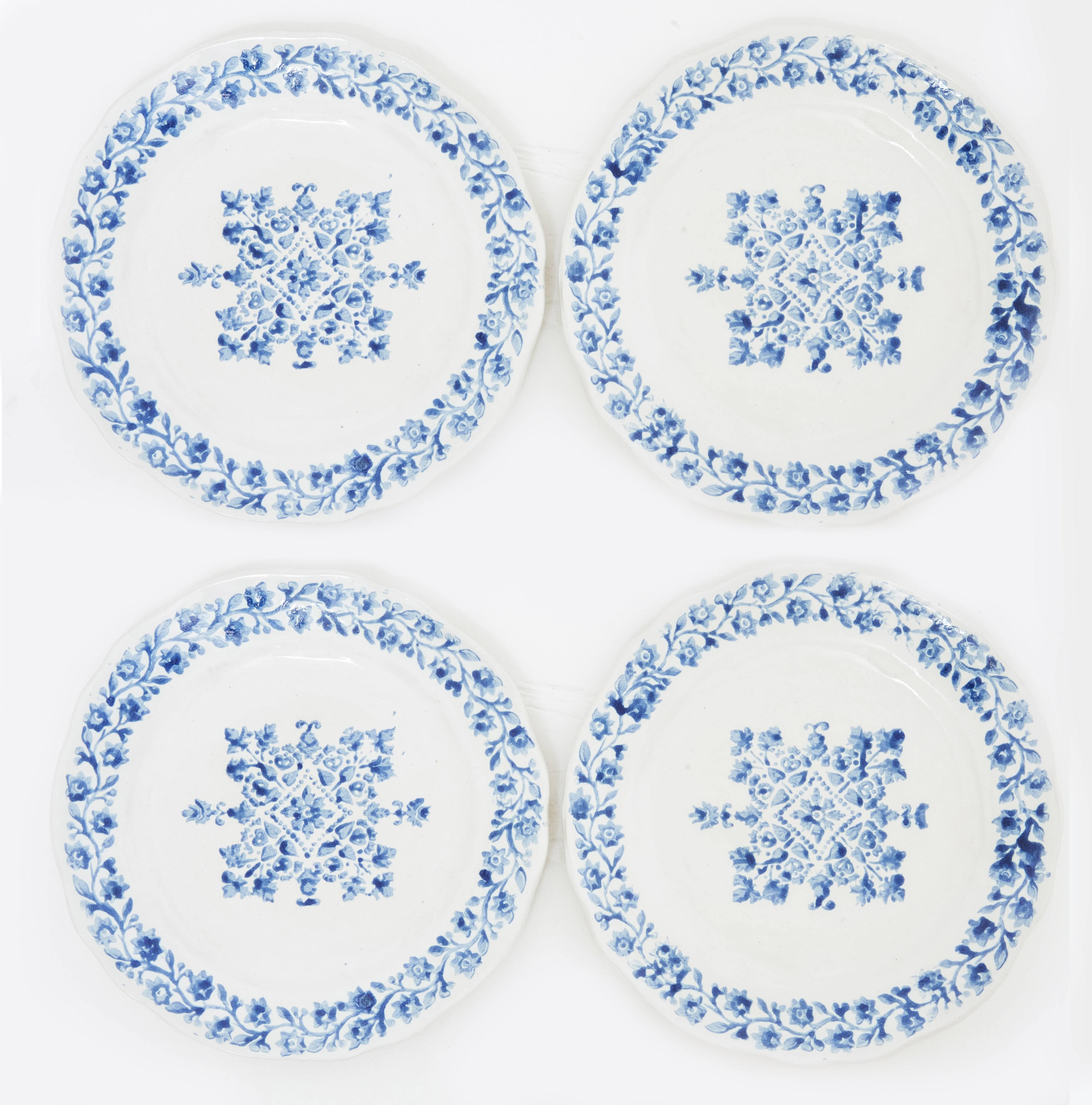 The ceramic plates are all handmade, hand-painted, and high-fired stoneware pieces rendering unique designs and employing a unique technique. The bottoms of the plates are not glazed. They are also dishwasher and microwave safe. The whole concept of