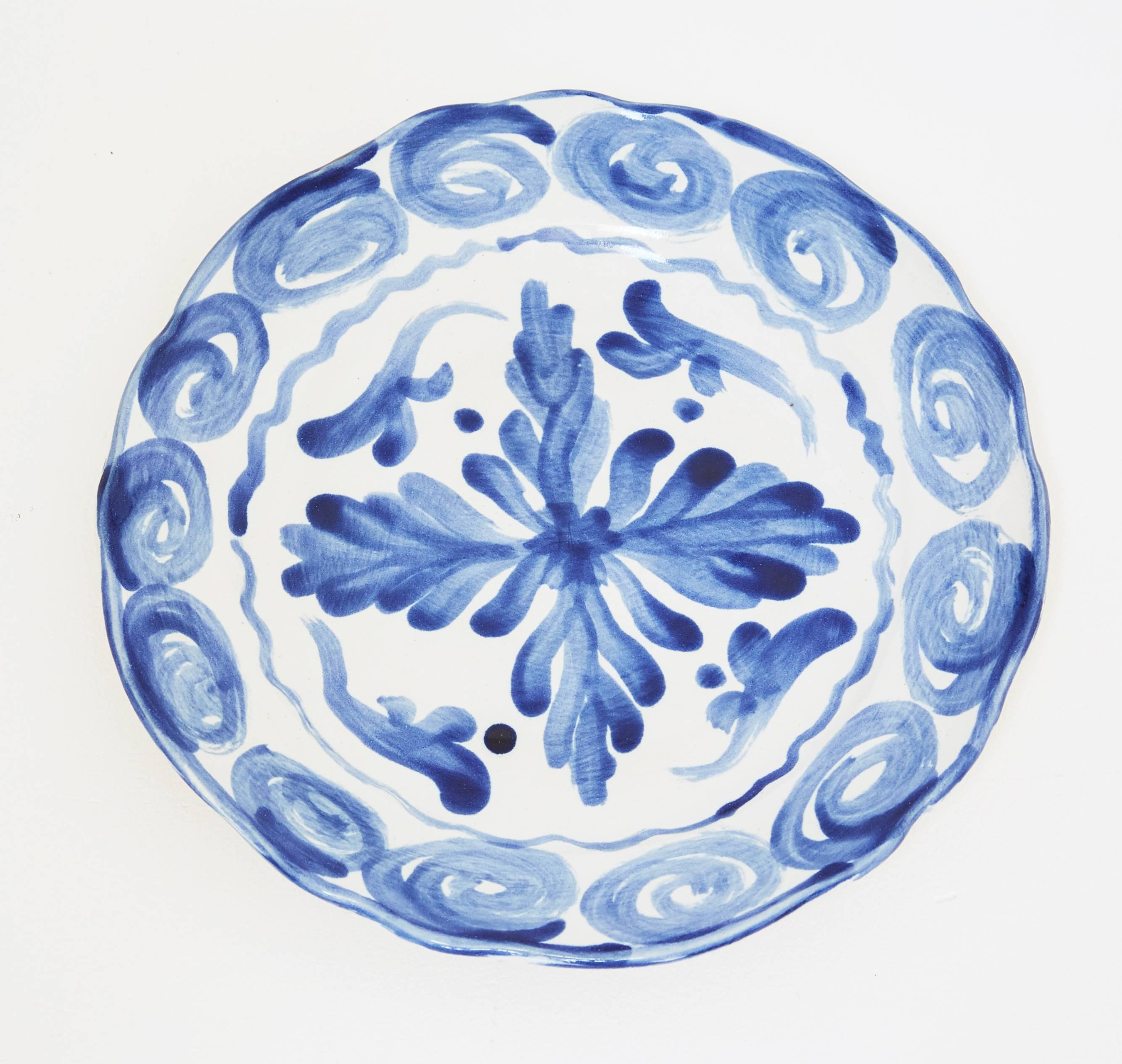 The ceramic plates are all handmade, hand-painted and high fired stoneware pieces rendering unique designs and employing a unique technique. The bottoms of the plates are not glazed. They are also dishwasher and microwave safe. The whole concept of