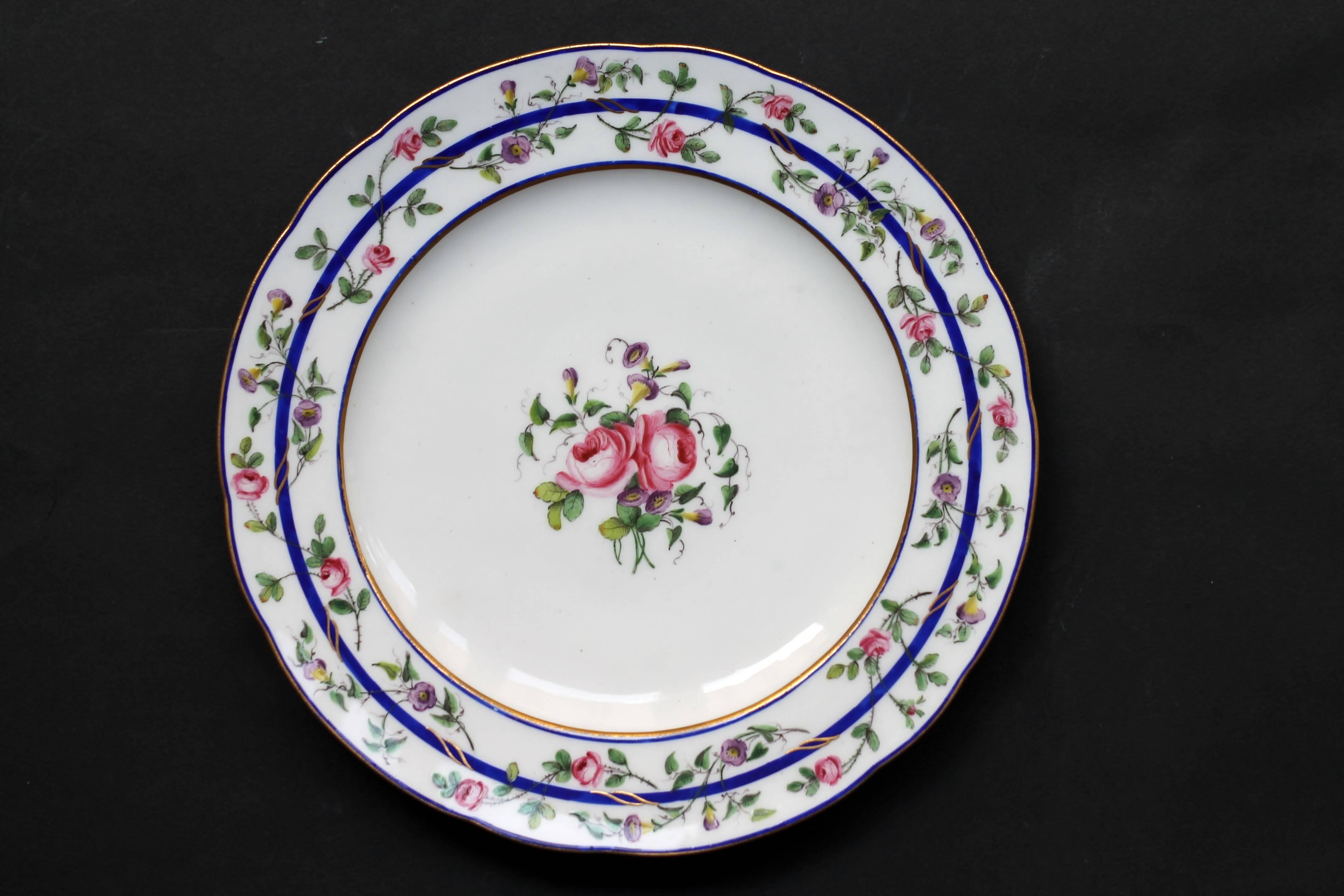 A Sevres porcelain (French) continuation of 12 plates (or 2x6) with polychrome decoration of garlands of pink and morning glory at the rim and flowers at the centre. Ligne in gold on the border.
Marked double L crossed for Sevres factory and 