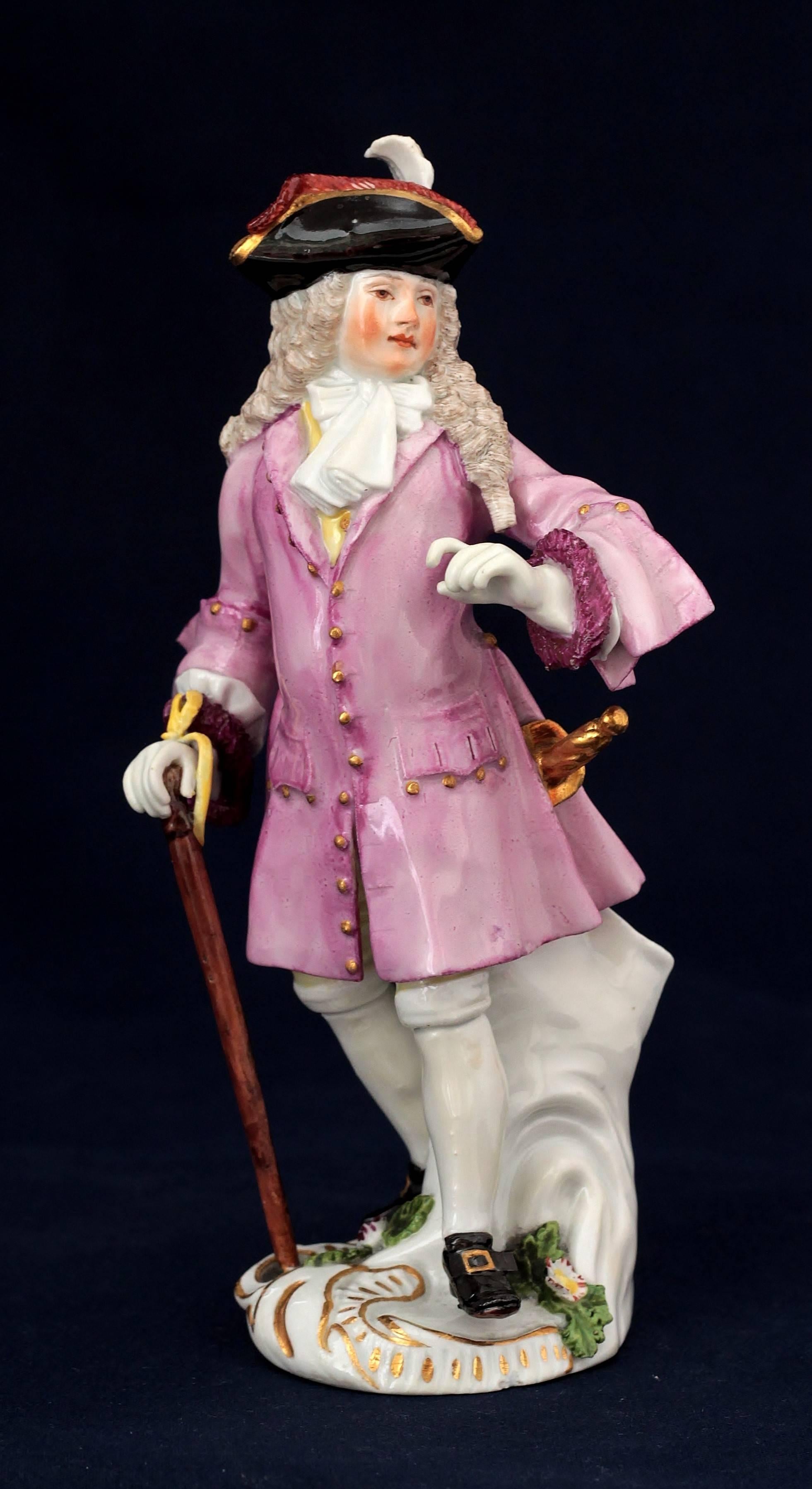 Meissen porcelain figure of The Squire of Alsatia, street traders of London. Model by J.J. Kaendler and P. Reinicke, circa 1754.
Sword-mark in blue on the plinth, scratch-mark “9” under the plinth.
Measures: Height: 14.4 cm, diameter: 8.3