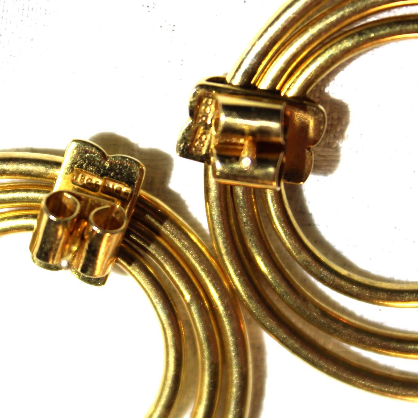 Pair of vintage heavy 18-carat yellow gold triple hoop earrings, probably Italian, 1980s. Measures: Diameter 4 cm. Weight approx 26.5 grams. 

Price 1,250.
 