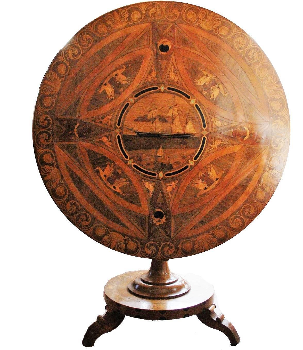 Rare mid-19th century Sorrento marquetry tilt-top centre table, the circular top extensively inlaid with various woods including olive, boxwood and others, some stained, depicting a central marinescape roundel, with various borders inlaid with