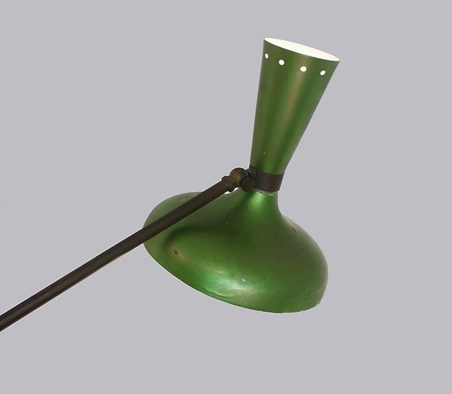 Extremely rare floor lamp in the style of Arredoluce attr. with three articulating arms with counterweights in metallic red, blue and green attached to a main central stem and a marble base. Each arm can be adjusted by a brass ball joint connected