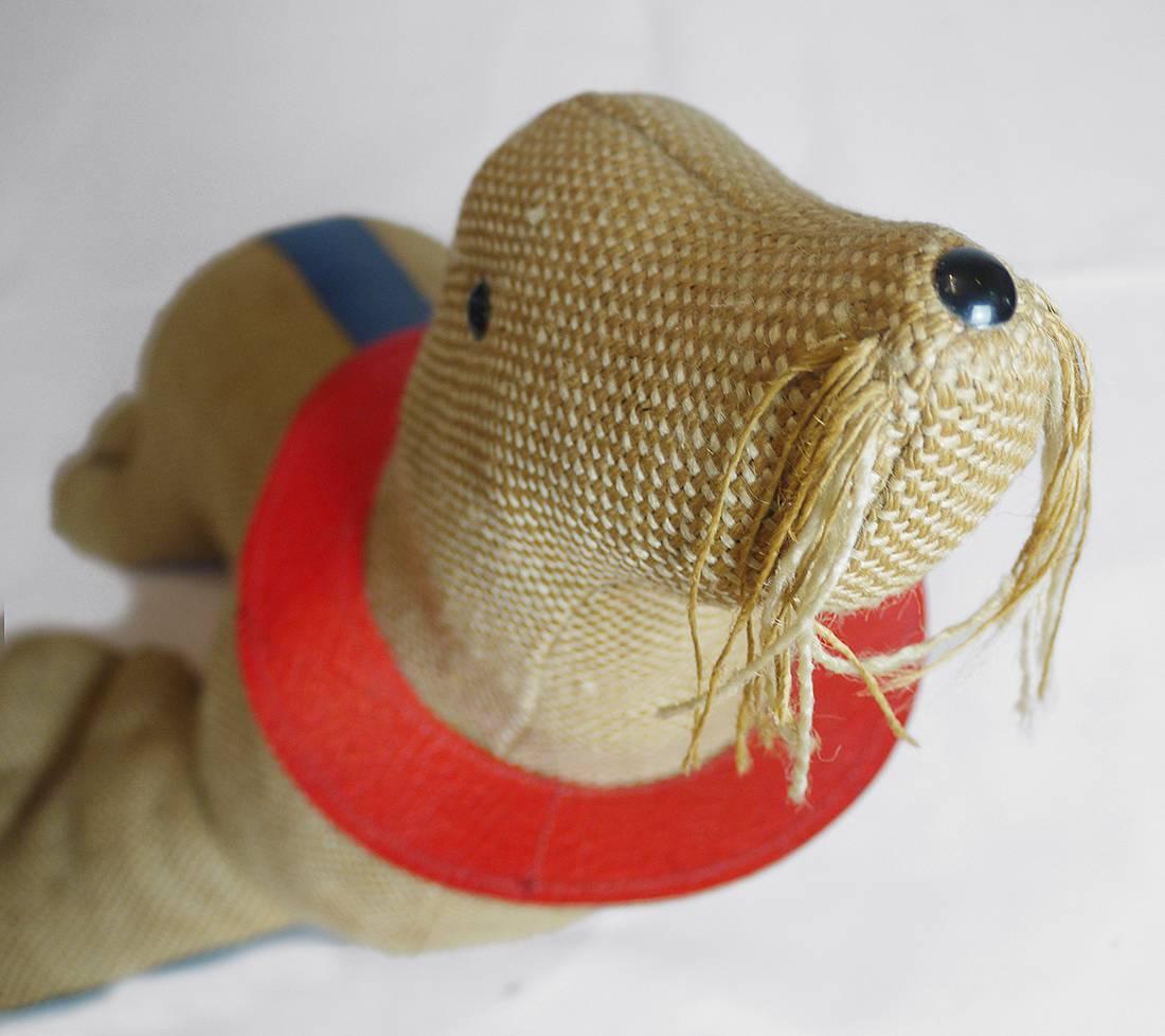 Iconic therapeutic toy seal by the eastern German designer Renate Müller. The typical use of jute and colored leather make these animals age quite characteristically. Manufactured in Germany, 1971.

Her animals have already been exhibited at the