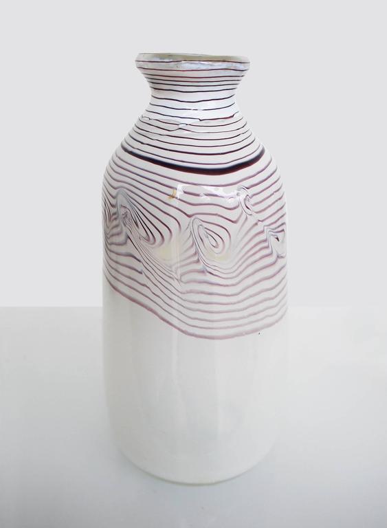 Milk glass vase with purple thread inclusions. Erwin Eisch (born 1927 in Frauenau, Germany) is one of the founders of studio glass in Europe. The vase is made in the 1970s-1980s, underneath with incised signature.
Weight: 1262 g/2.78 lb. 