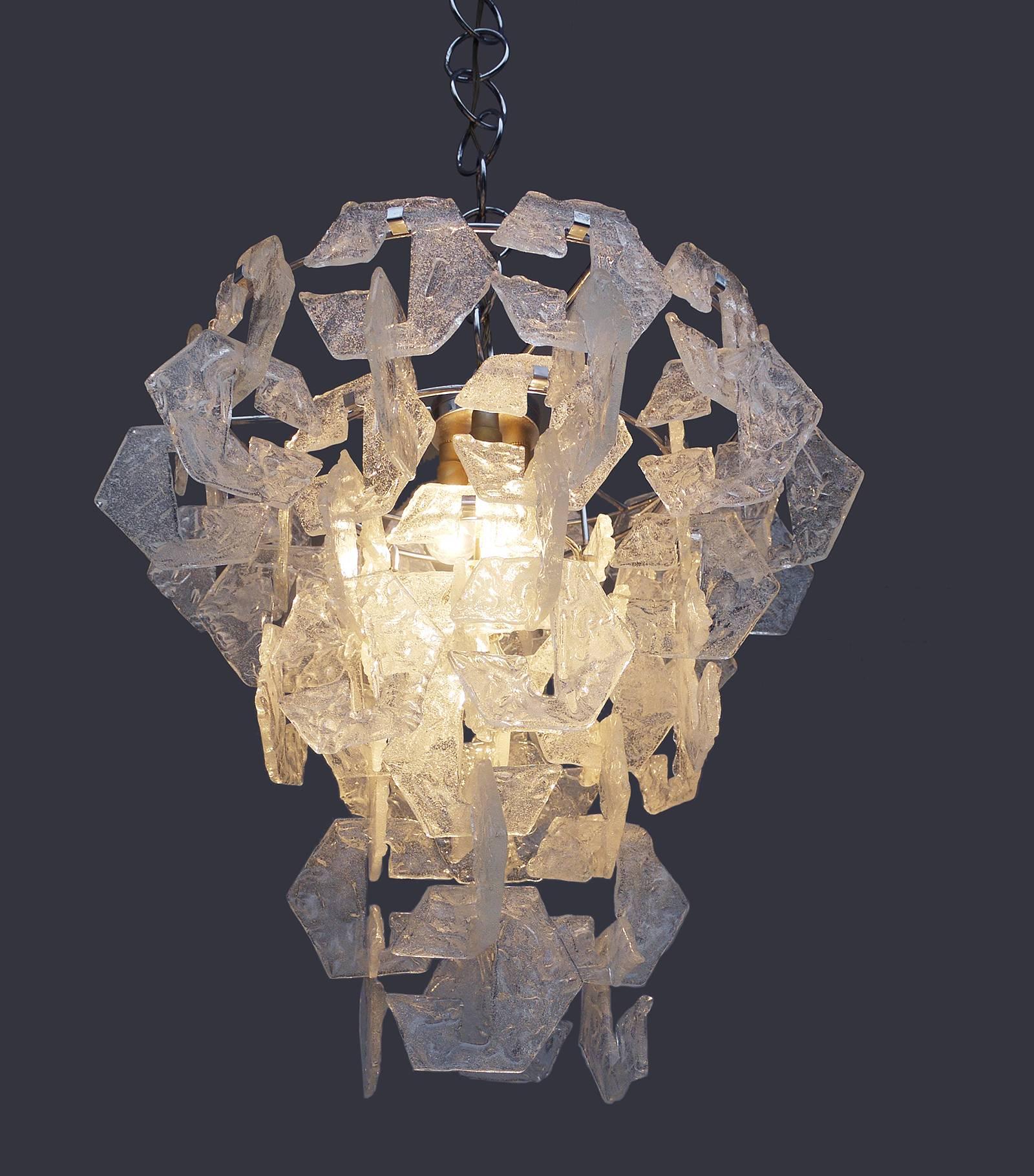 Elegant handcrafted chandelier with square C-link frosted Murano glass pieces on a chromed frame. Each piece of glass hangs from the one above. Chandelier illuminates beautifully and offers a lot of light. Gem from the time. With this light you make