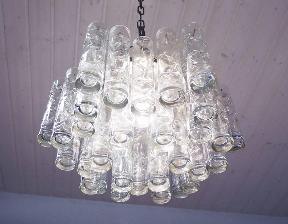 Elegant flush mount chandelier with twenty-four handblown 'Lava' Murano glass tubes in three different lengths on a brass and partly nickel-plated frame. Manufactured by Doria, Germany, in the 1960s. 

Lighting: takes one large Edison E27 base screw