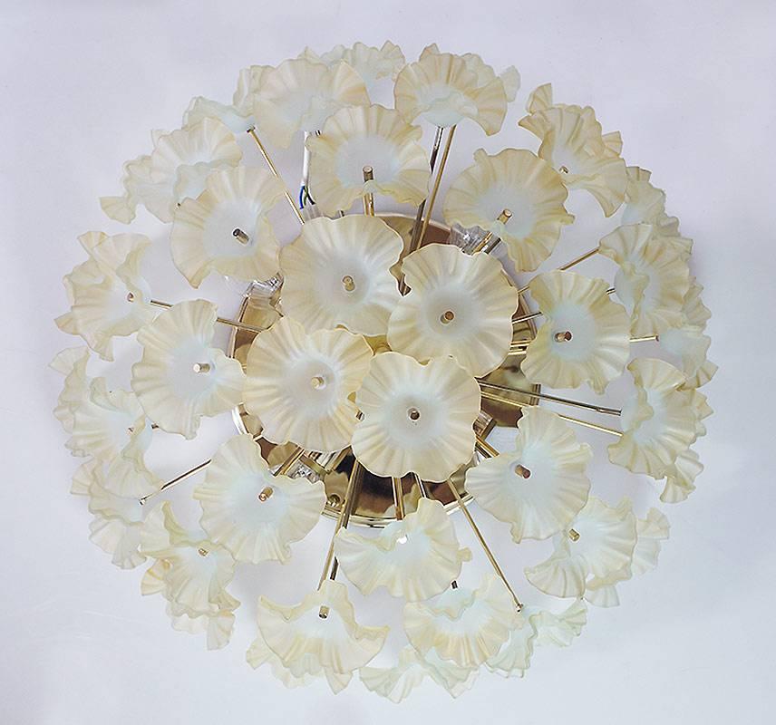 Elegant sputnik flush mount ceiling light with Murano glass flowers with a hint of beige and turquoise-blue on a brass frame. Manufactured in Italy, 1960s. 

Lighting: takes four small Edison E14 base screw bulbs. 
Wattage: we recommend up to 40w