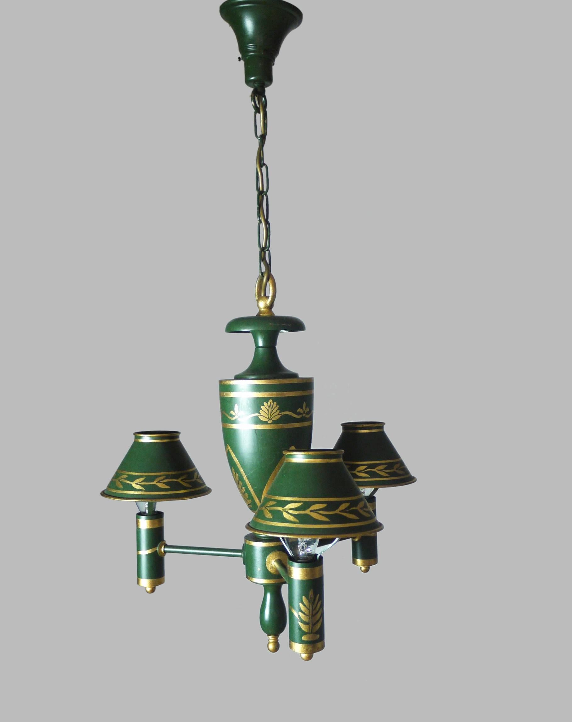 Elegant green French wooden chandelier with gilt painted decorations and with metal shades. 

Lighting: takes three small Edison E14 base candelabra bulbs. 
Condition: very good vintage condition. 

Wiring: the lamp has been tested with US American