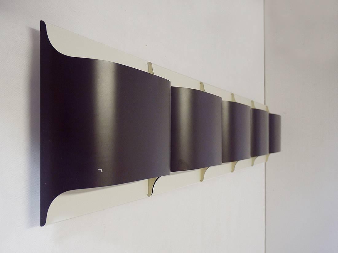 Elegant set of five metal wall panels by Staff, Germany, designed by R. Krueger & D. Witte 1968.

Lighting: takes one large Edison base bulb per sconce. 
Condition: very good vintage condition. 

Price is per Set. 
 
Wiring: the lamp/s has been