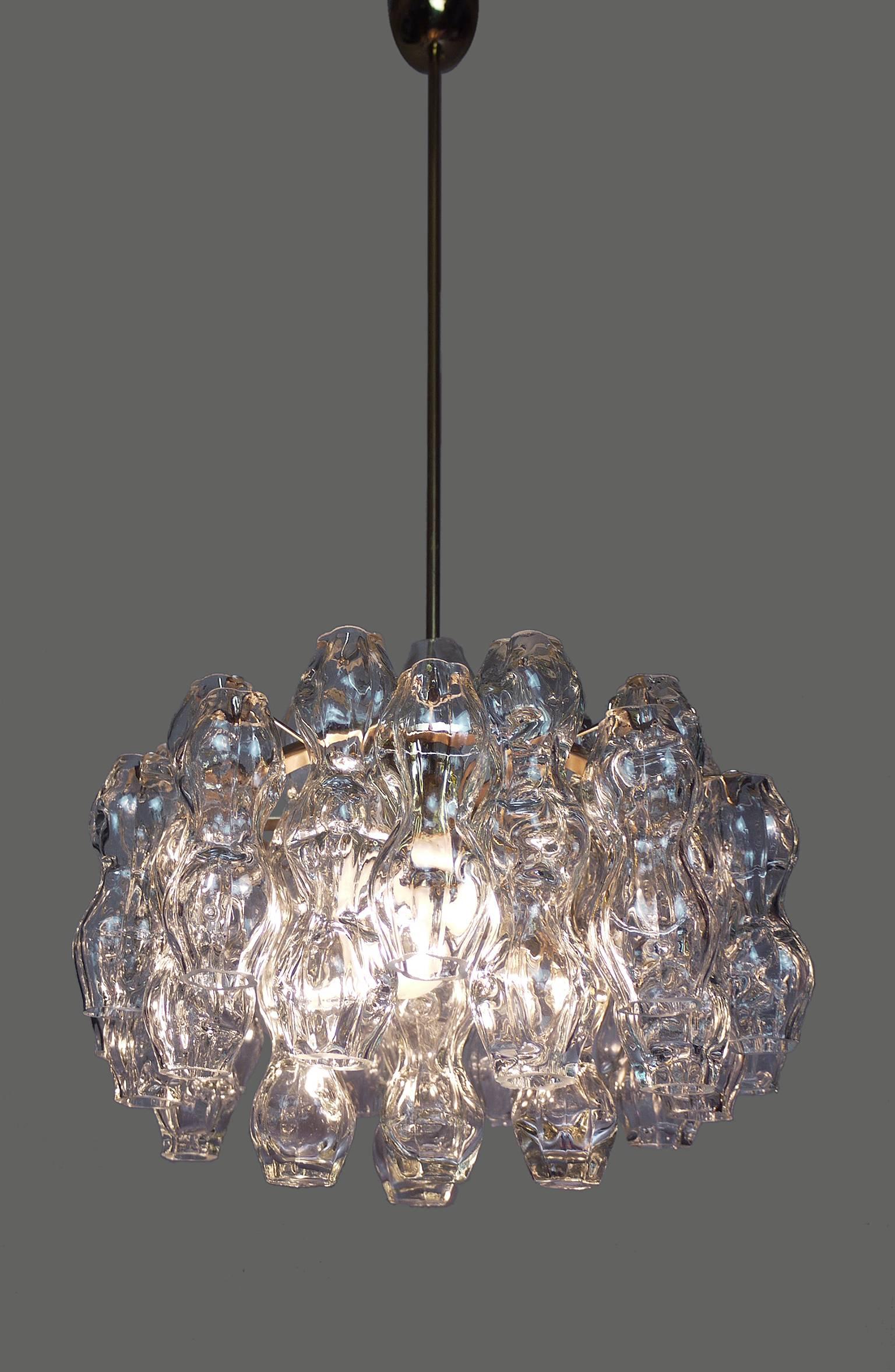 Blown Murano bubble glass chandelier made by Doria, Germany in the 1960s.
Brass frame with three large Edison base bulbs.
Labeled with Doria.
 