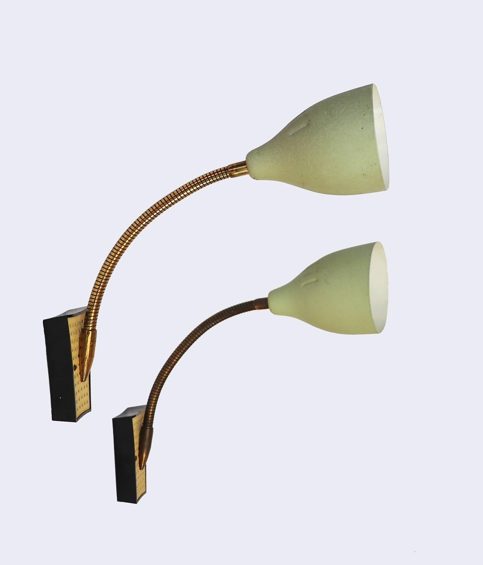 Elegant pair of adjustable Italian mid century gooseneck wall sconces made of perforated brass, enameled. 

Lighting: takes one Edison base screw bulb per lamp. 
Wattage: we recommend up to 60w per bulb. Works on 220v as well as 110v. 
Condition: