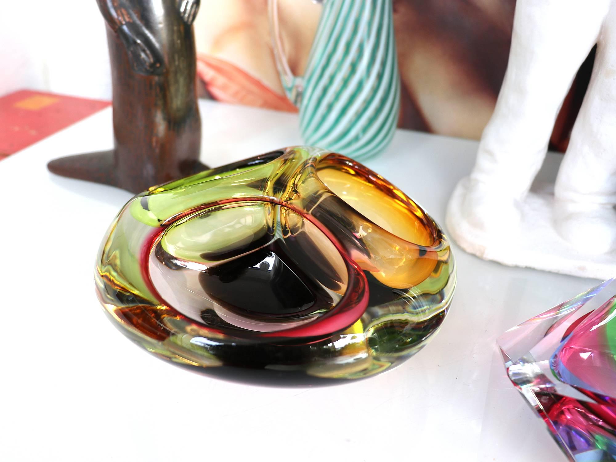 A biomorphic thick glass bowl with three sections made in Murano, Venice Italy in the 1960s. 