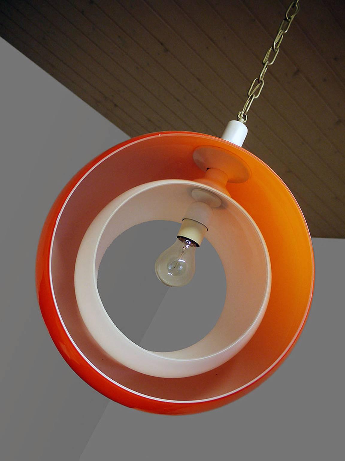 Murano glass pendant lamp by Carlo Nason for Mazzega, Italy with an orange glass globe and a white opaline glass moving part. Designed in the 1960s, Italy.
The lamp takes one large Edison bulb.
Measures: Diameter 15 in./ 38 cm
Height 17.7 in. /