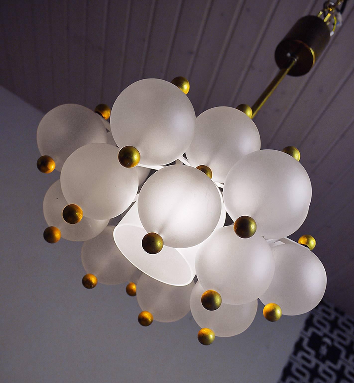 Chandelier with crystal glass balls suspended from the brass/white lacquered armature. Design by J.T. Kalmar in the 1960s.
The lamp takes one large Edison bulb.
    